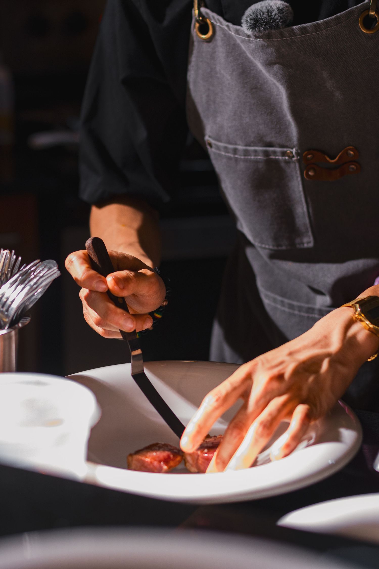Food photography for tasting menu, clean style, chef putting finishing touches on dish