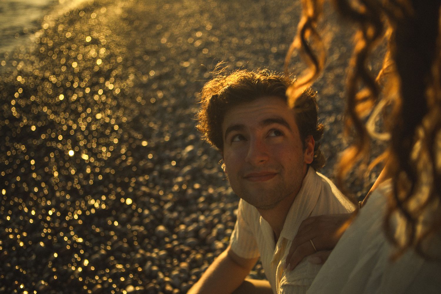 Cinematic documentary-style couples photography taken in Toronto nature, candid and emotional interaction, beach