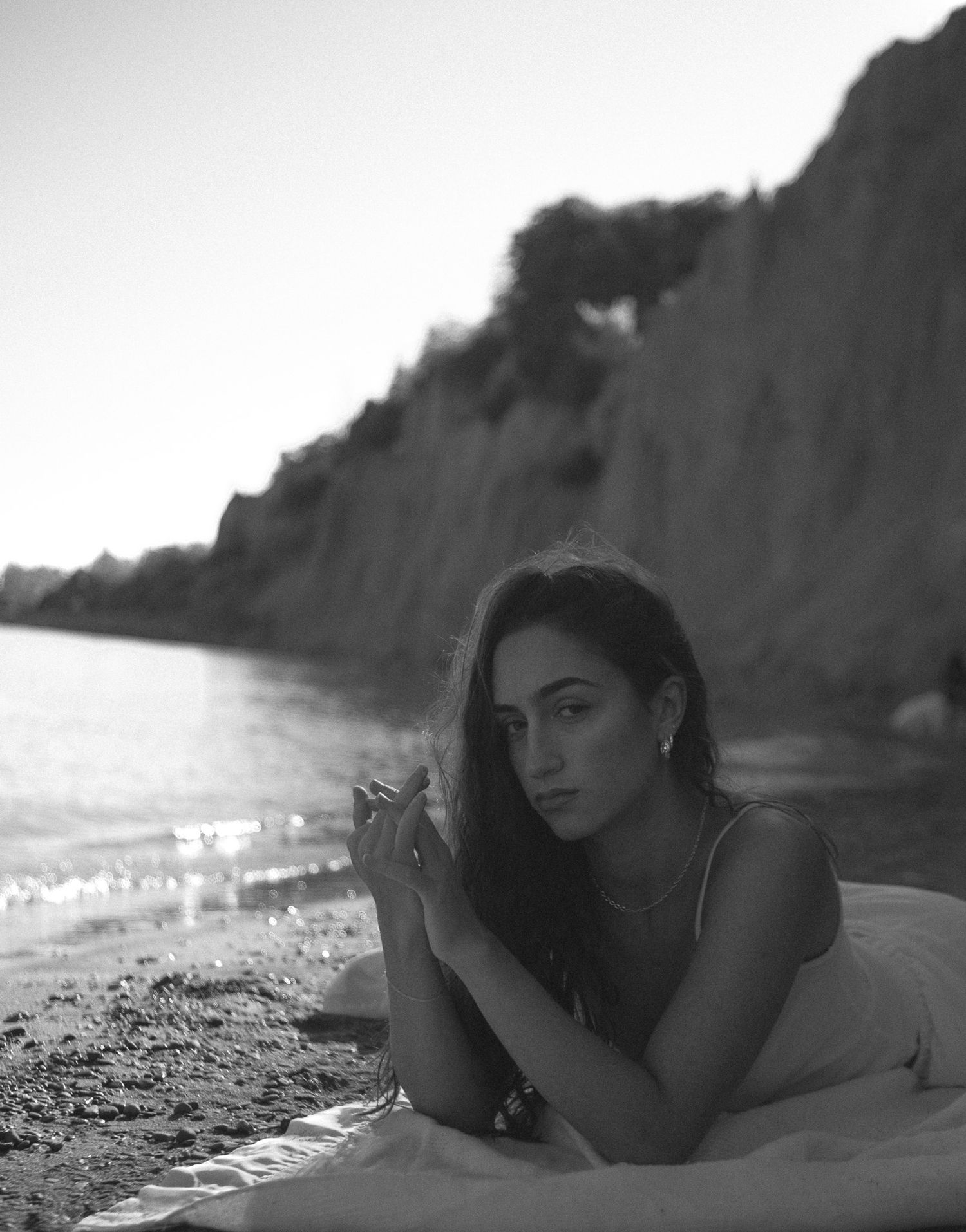 Portrait photography of girl laying on beach, Toronto