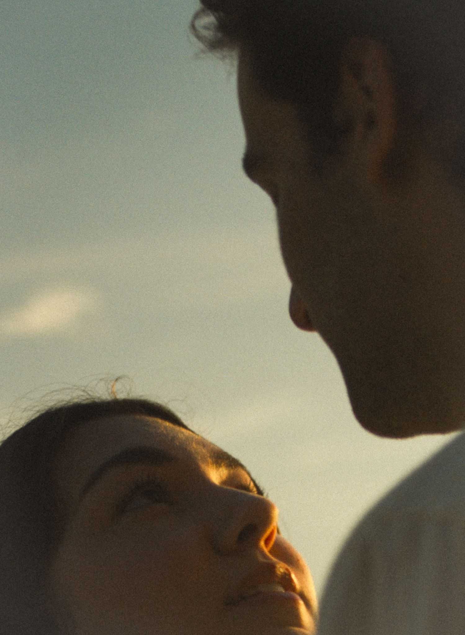 Cinematic documentary-style couples photography taken in Toronto nature, candid and emotional interaction, beach