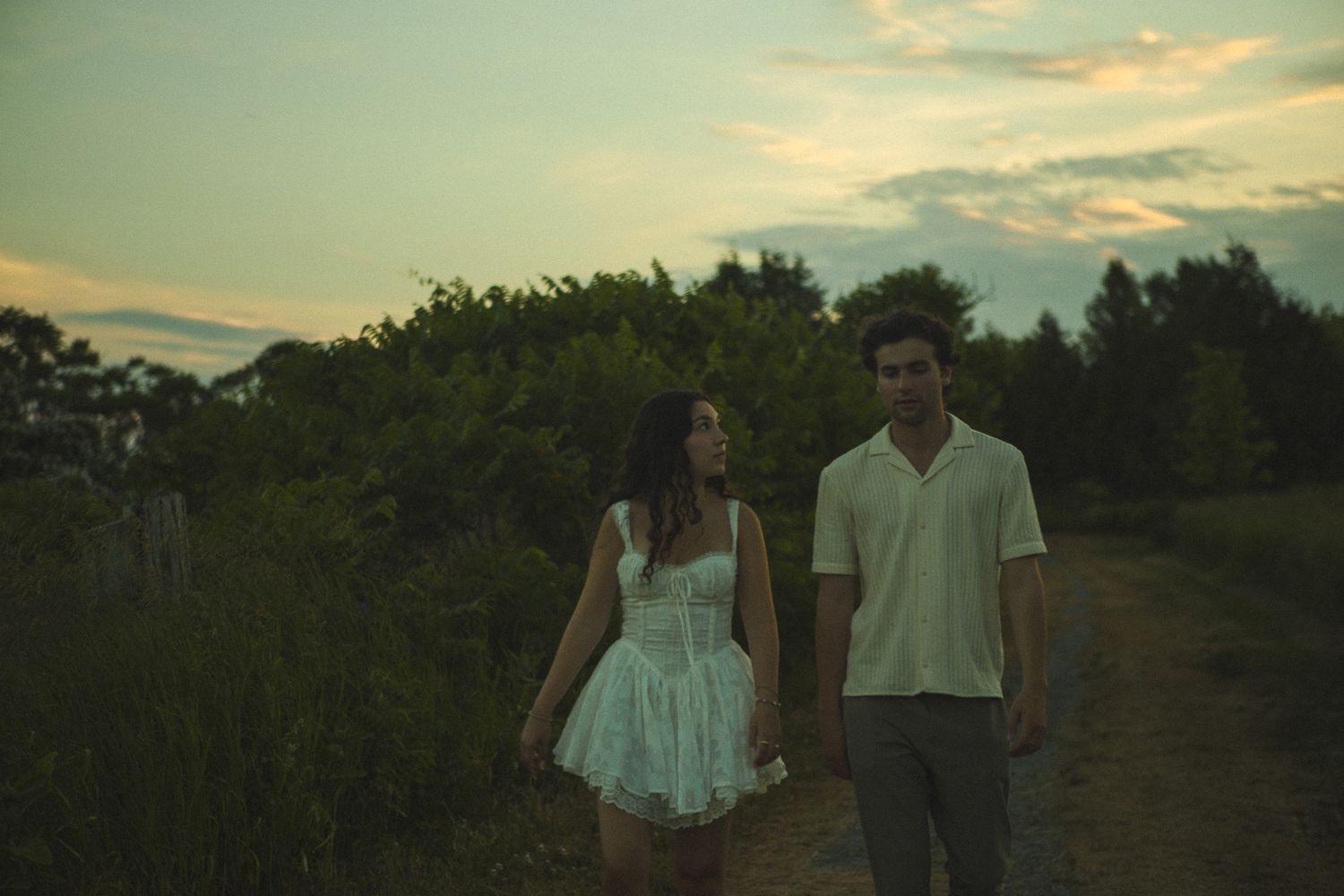 Cinematic documentary-style couples photography taken in Toronto nature, candid and emotional interaction, beach