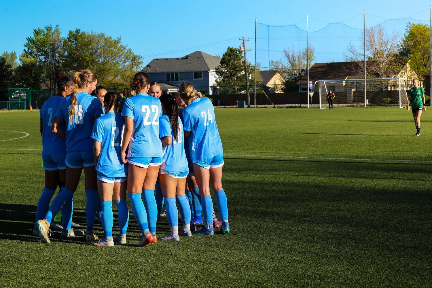 CCU Cougars Soccer Team Huddles on the Pitch