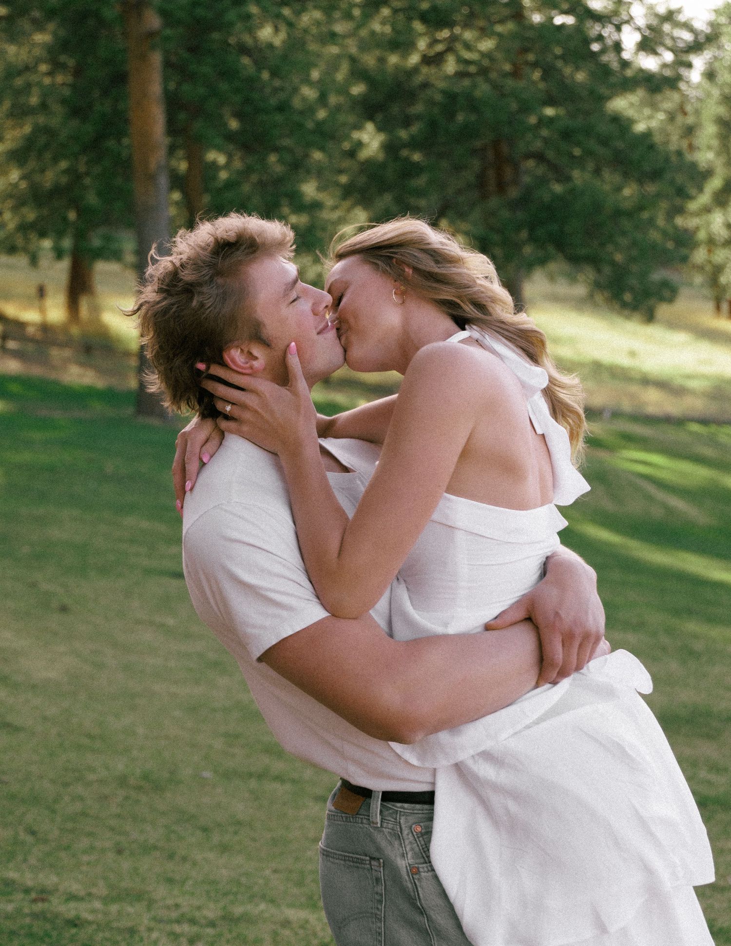 Couple Kissing in a Colorado Meadow Engagement Session