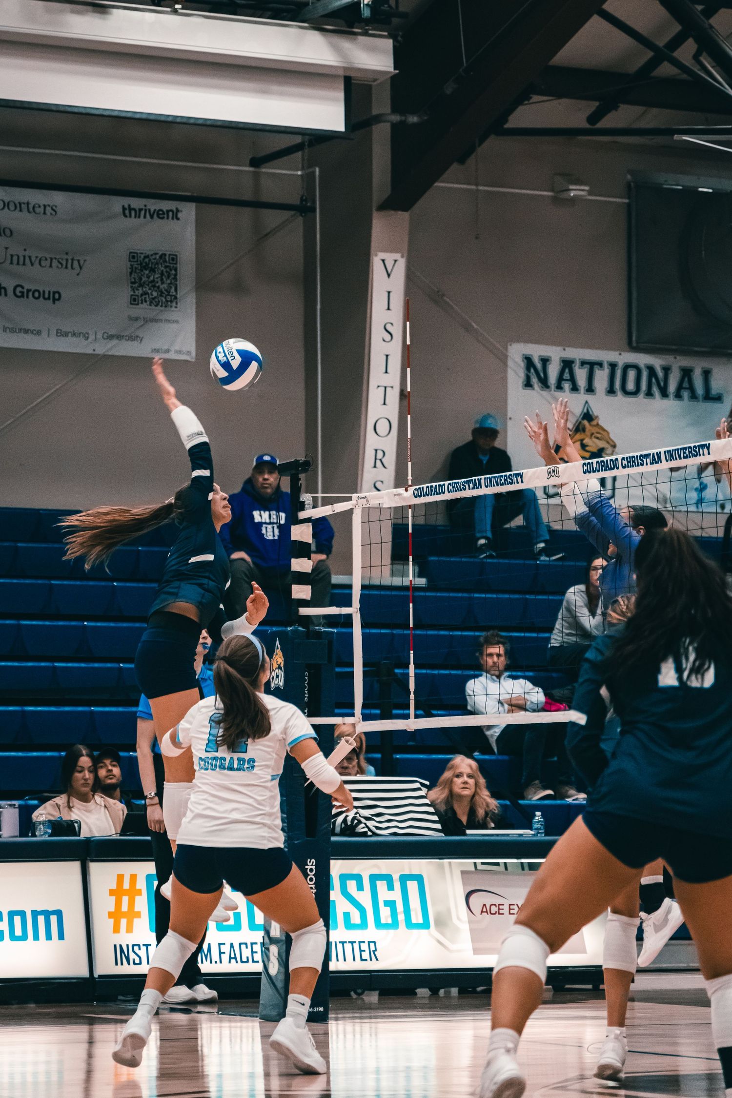 CCU Cougars #14 Sends the Ball Flying Past the Block