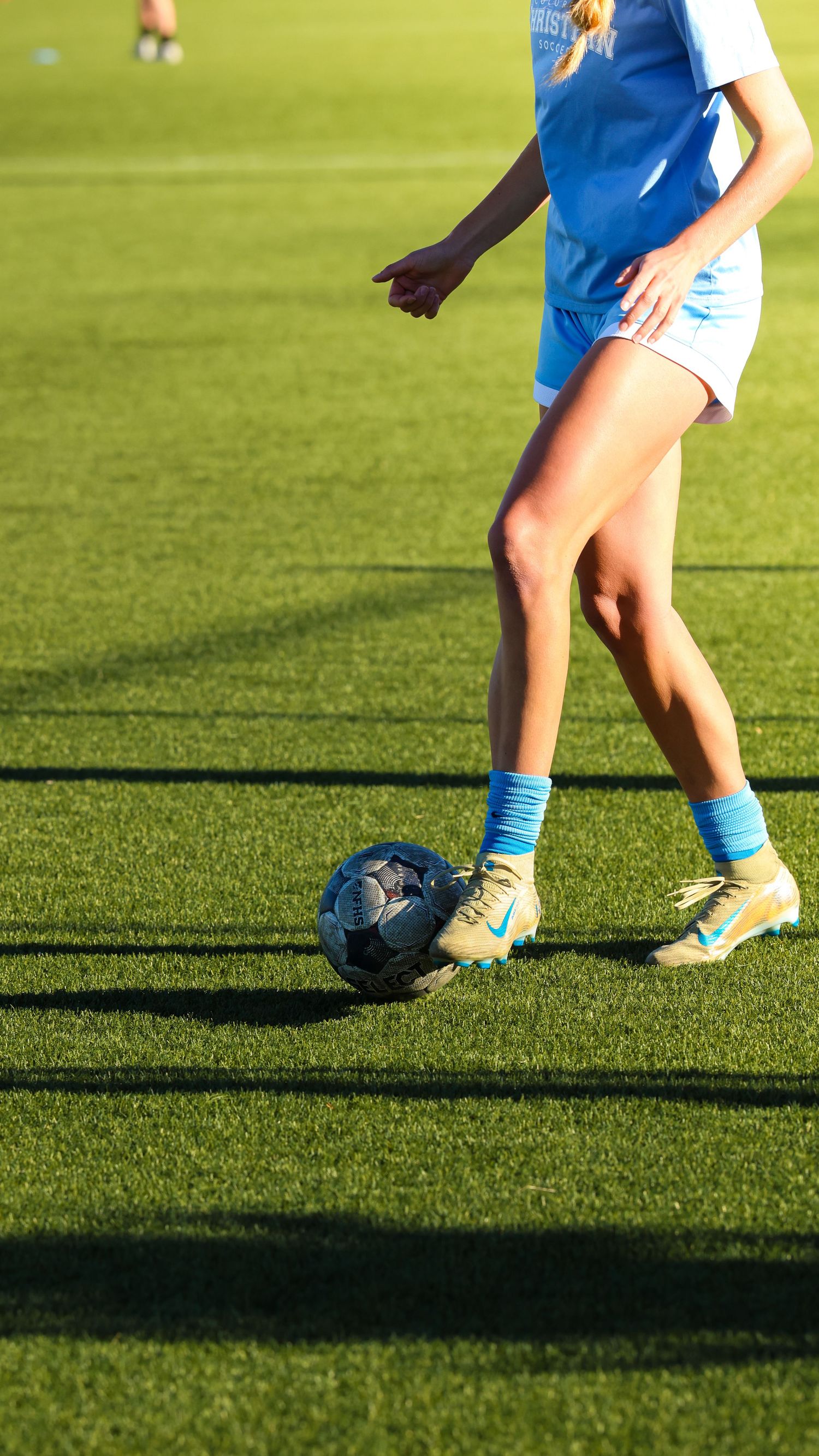 CCU Cougars Soccer Player Dribbles Downfield