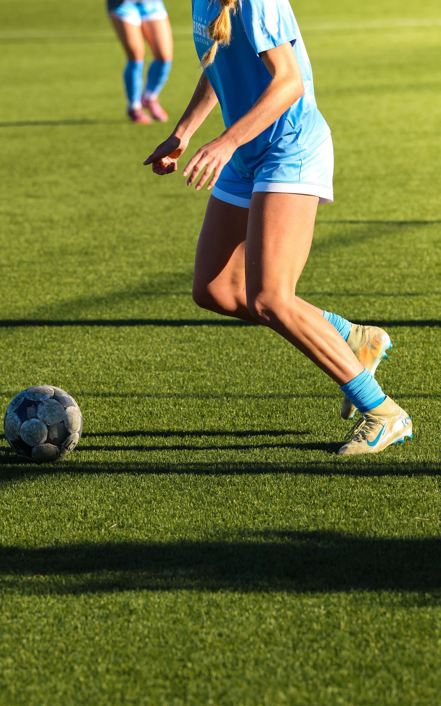 CCU Cougars Soccer Player Chases Down the Ball