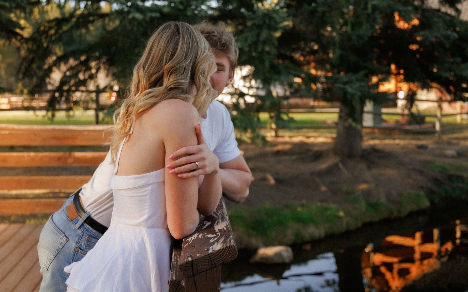 Golden Hour Engagement Embrace by a Creek in Evergreen, Colorado