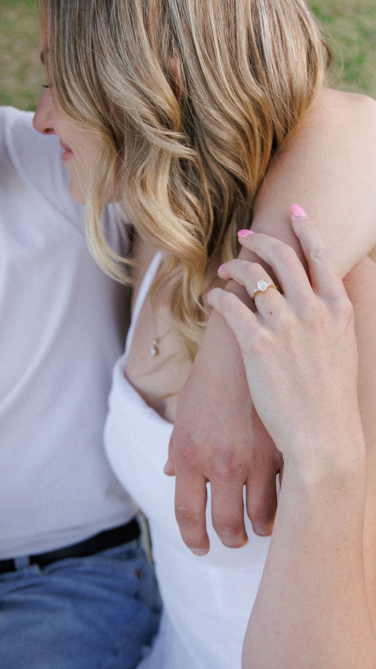 Engagement Ring Detail with Bride Holding Groom's Arm