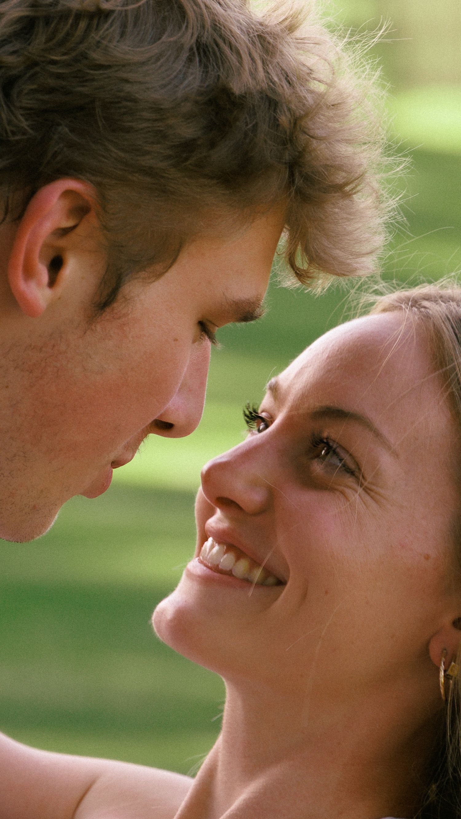 Nose-to-Nose Engagement Portrait in Evergreen, Colorado Meadow
