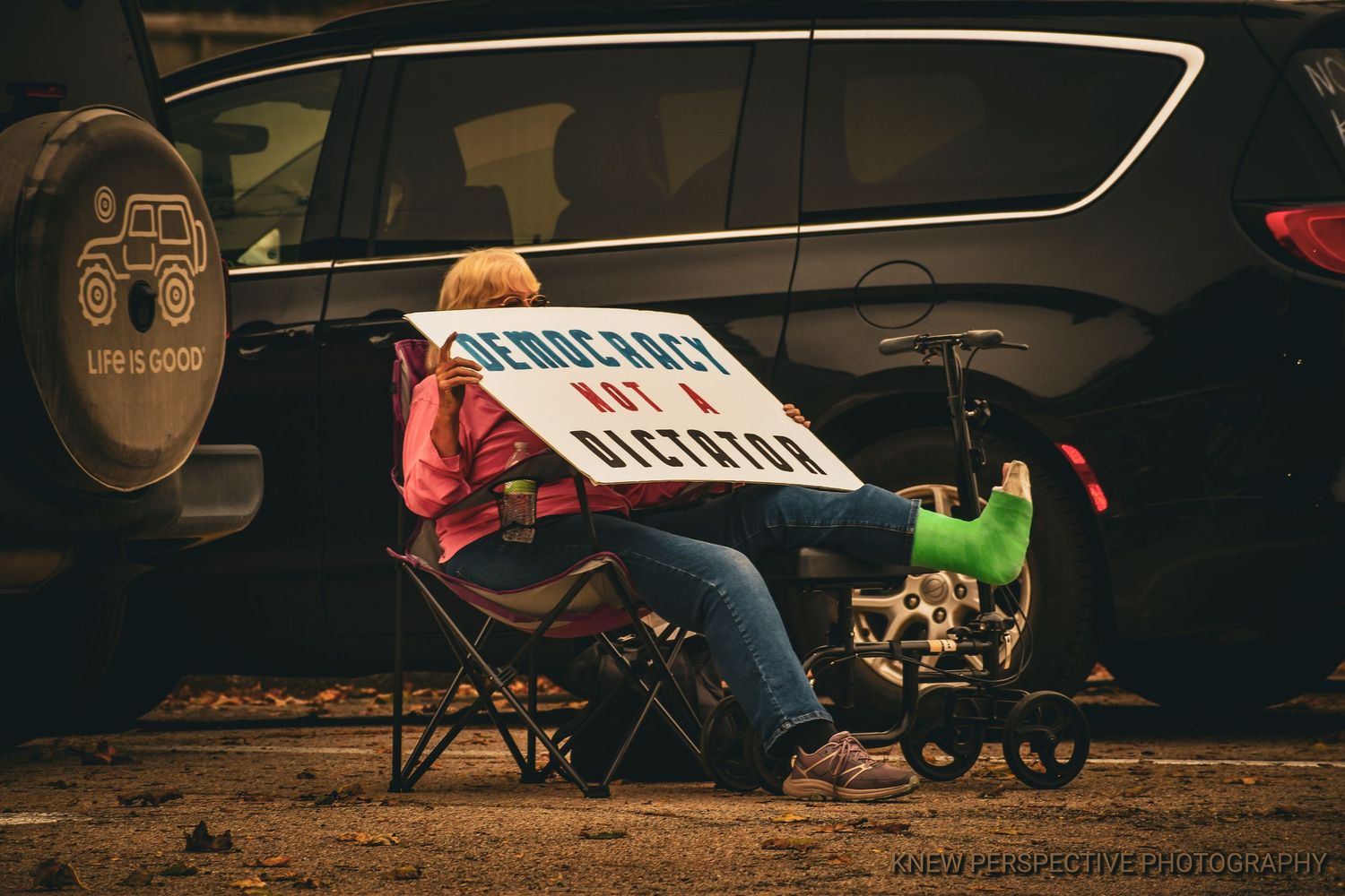 A dedicated protester sporting a bright green cast on her broken leg.