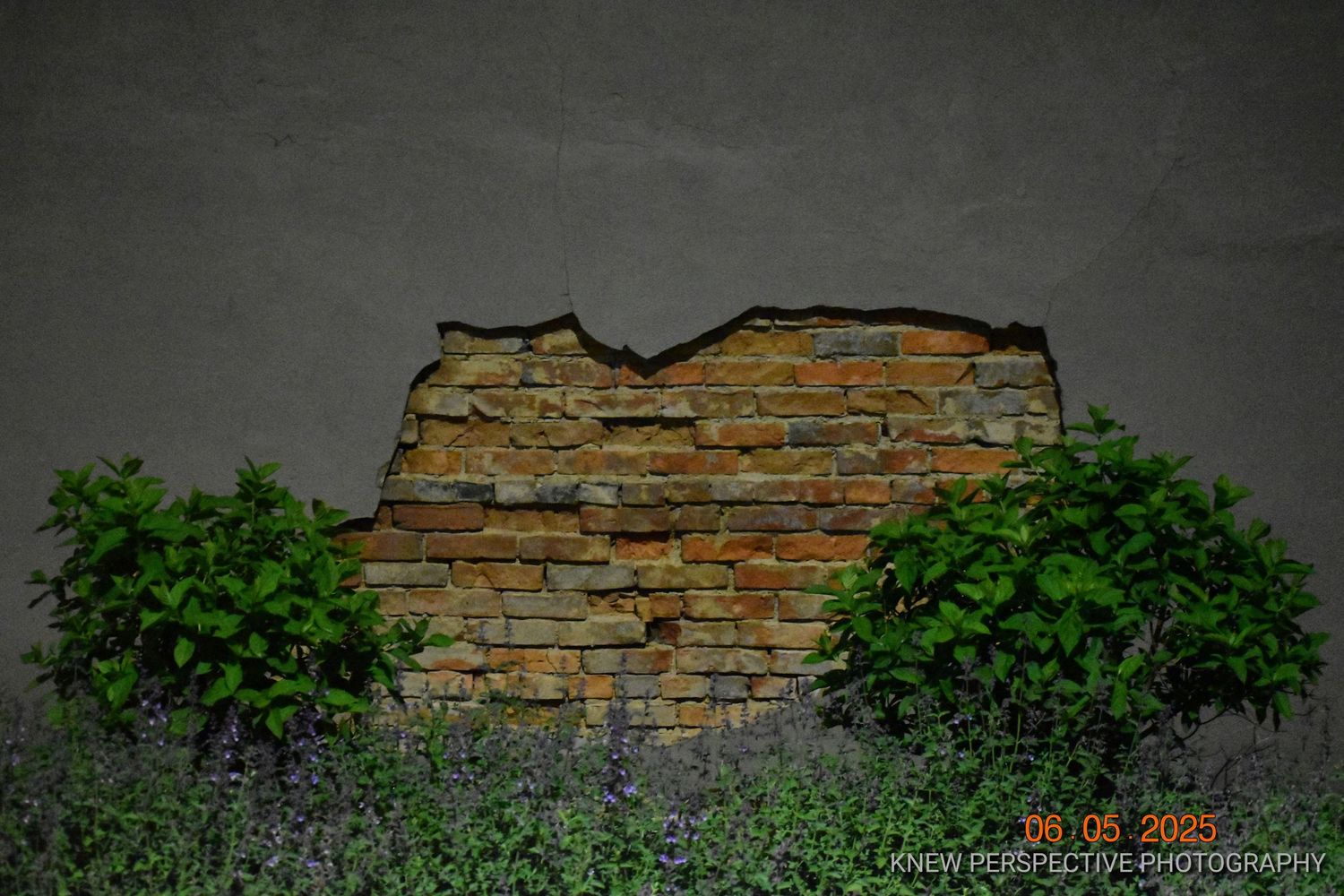 A hidden brick wall being exposed.