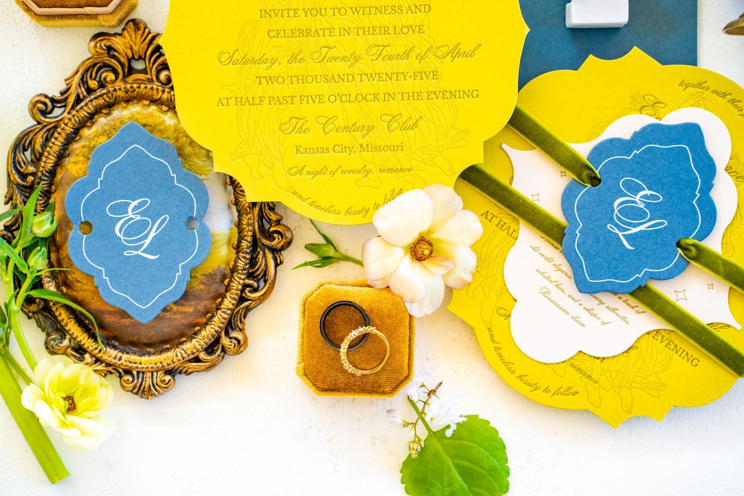 Wedding stationery layout with blue and gold vintage frames on bright yellow background.