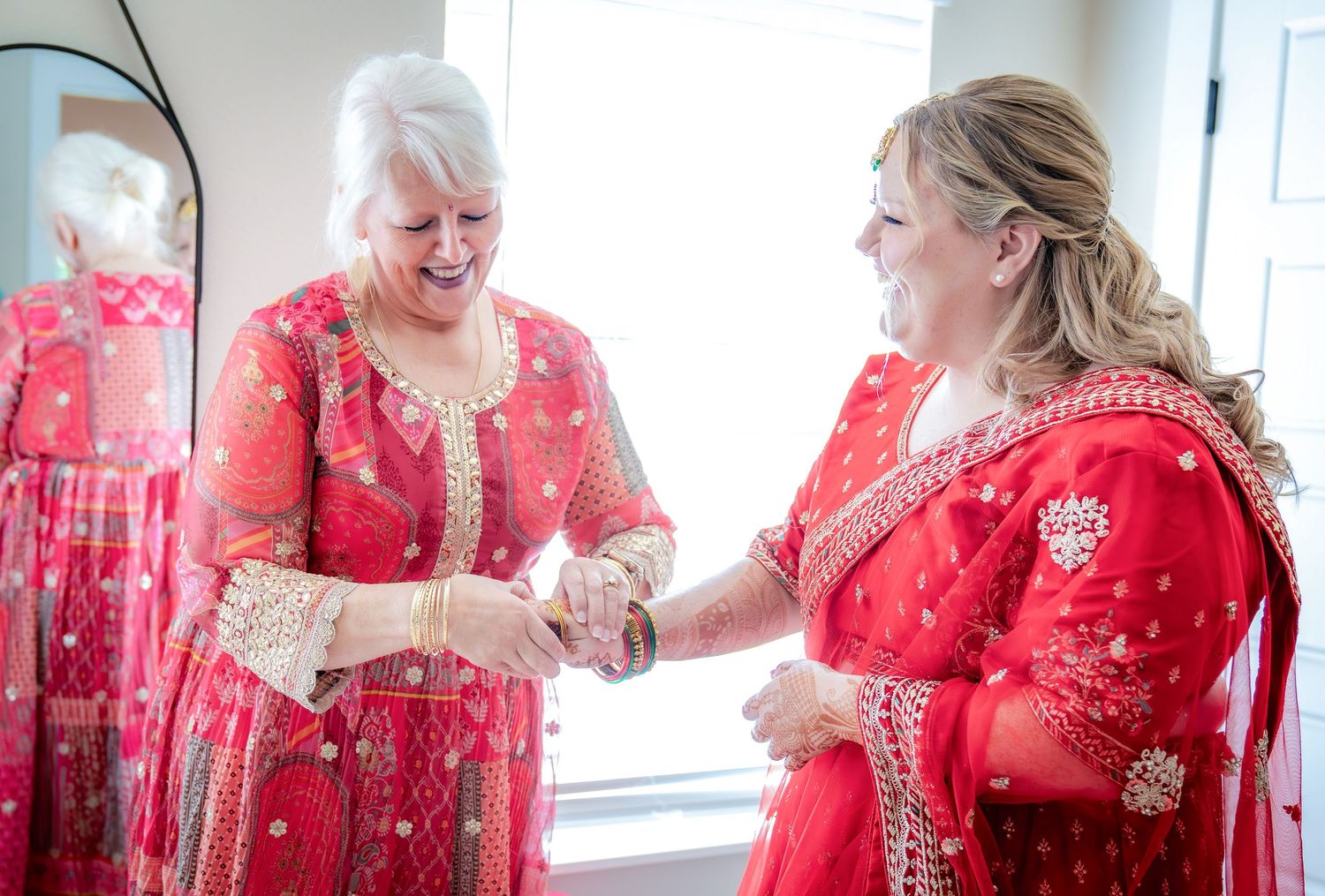Festive celebration scene with bright red traditional attire and decorative details.