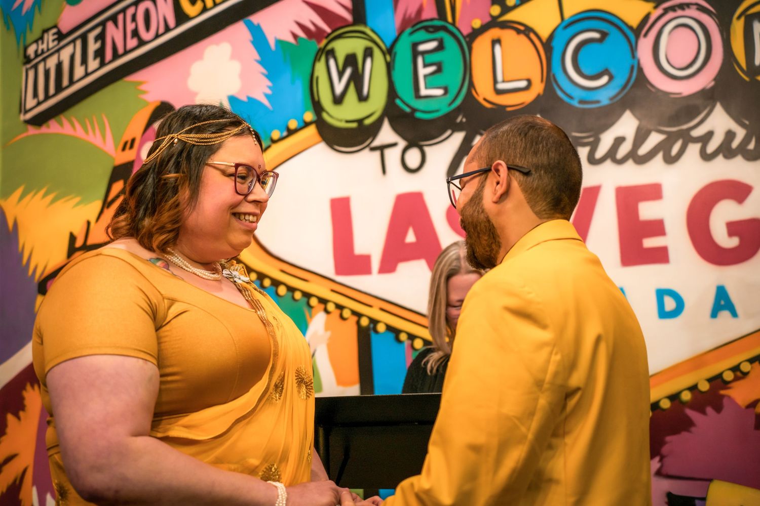 Colorful Las Vegas style welcome signs and decorative elements at an event.