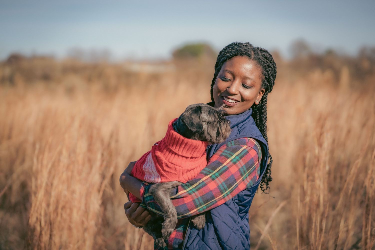 Intimate portrait session in a golden grass field during sunset.