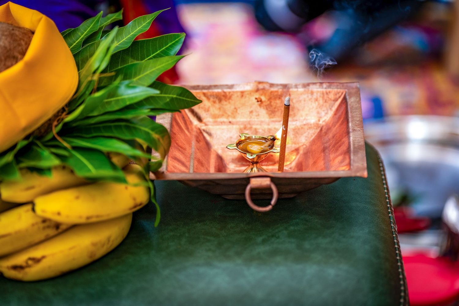 Traditional wedding decorations and fruits displayed on ceremonial table.