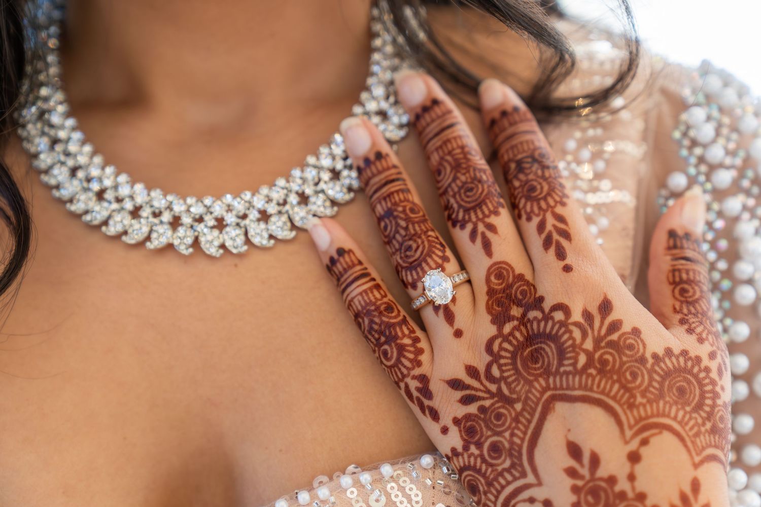 Intricate bridal mehndi designs and diamond jewelry details.