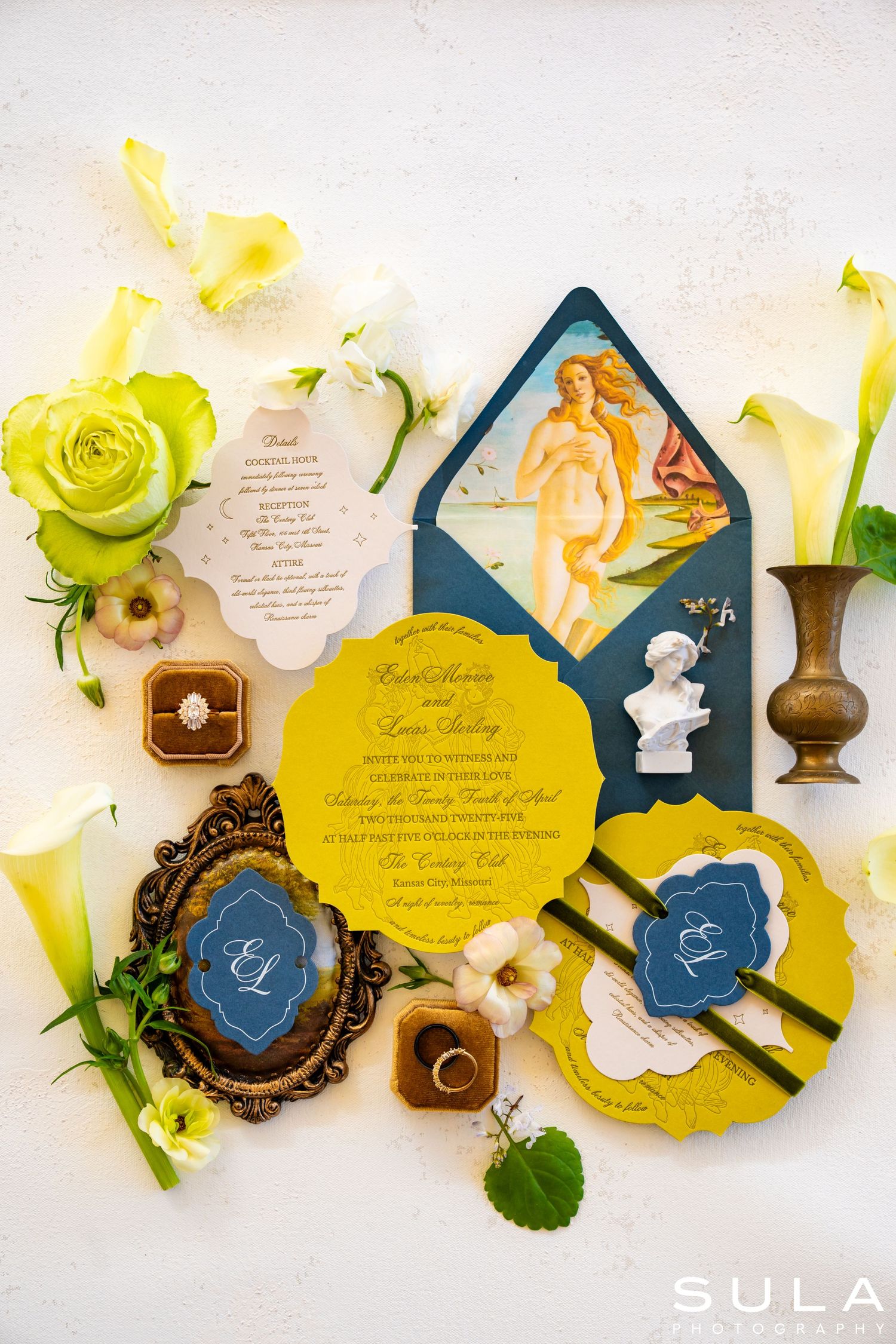 Wedding invitation suite featuring yellow and navy blue designs with floral accents and elegant calligraphy.