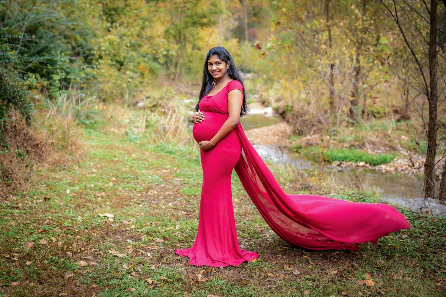 A flowing red dress creates dramatic movement in a series of outdoor portrait shots.