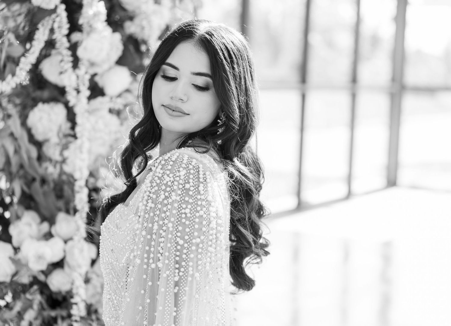 Black and white bridal portrait with romantic lace details.