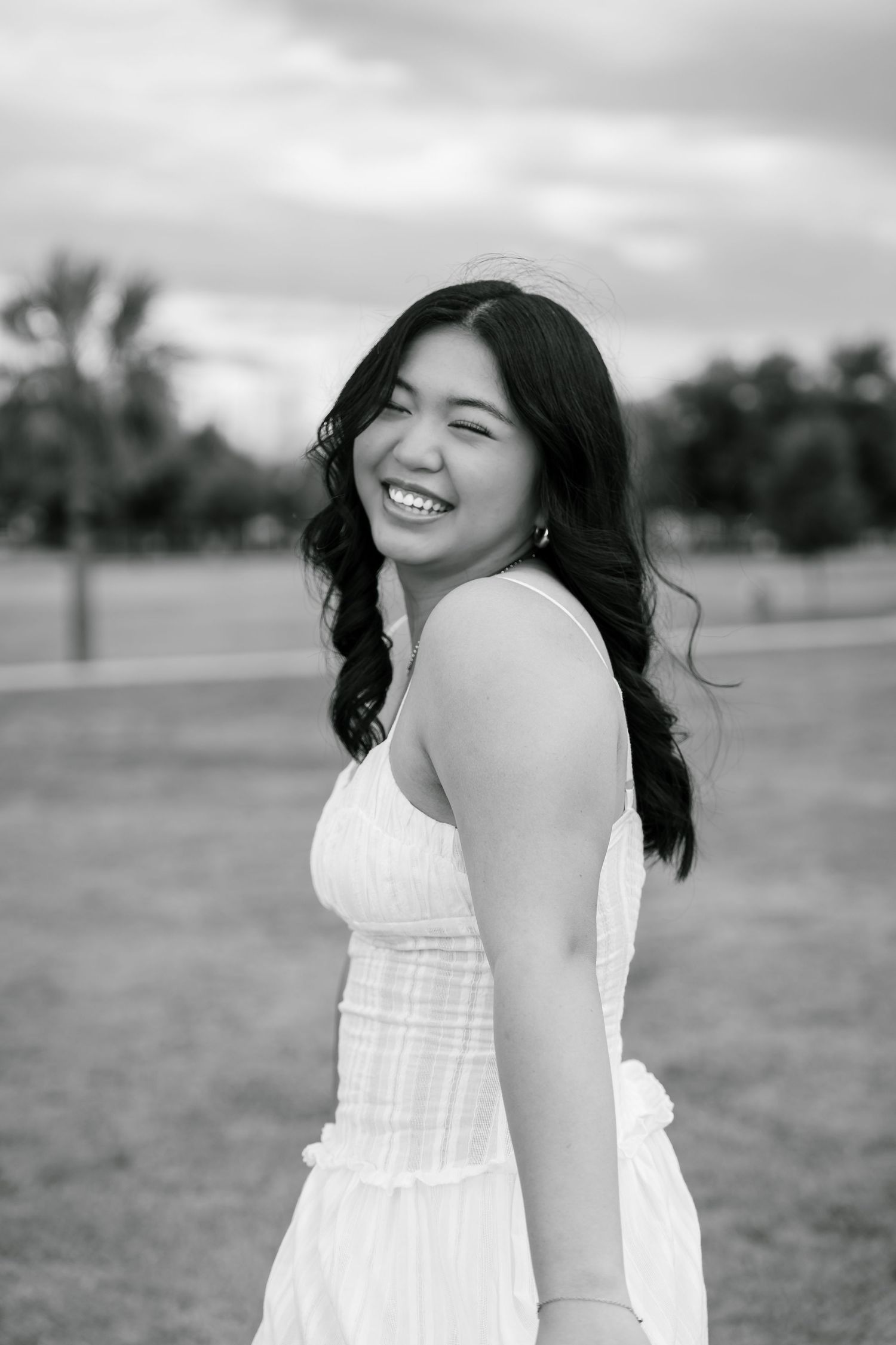 A wide smile for a portrait session at the park.