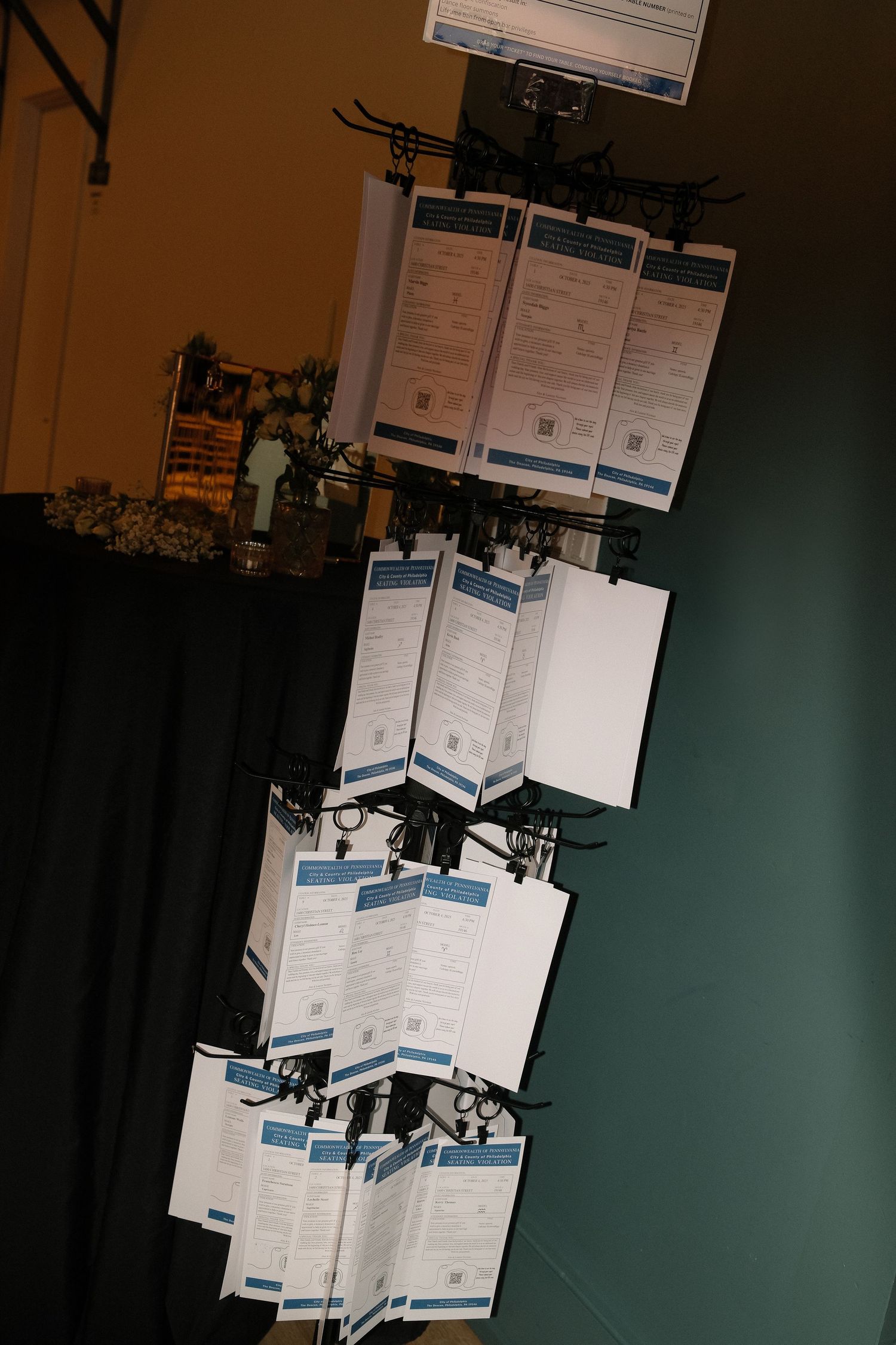 Multiple paper documents displayed on stands against a dark background.