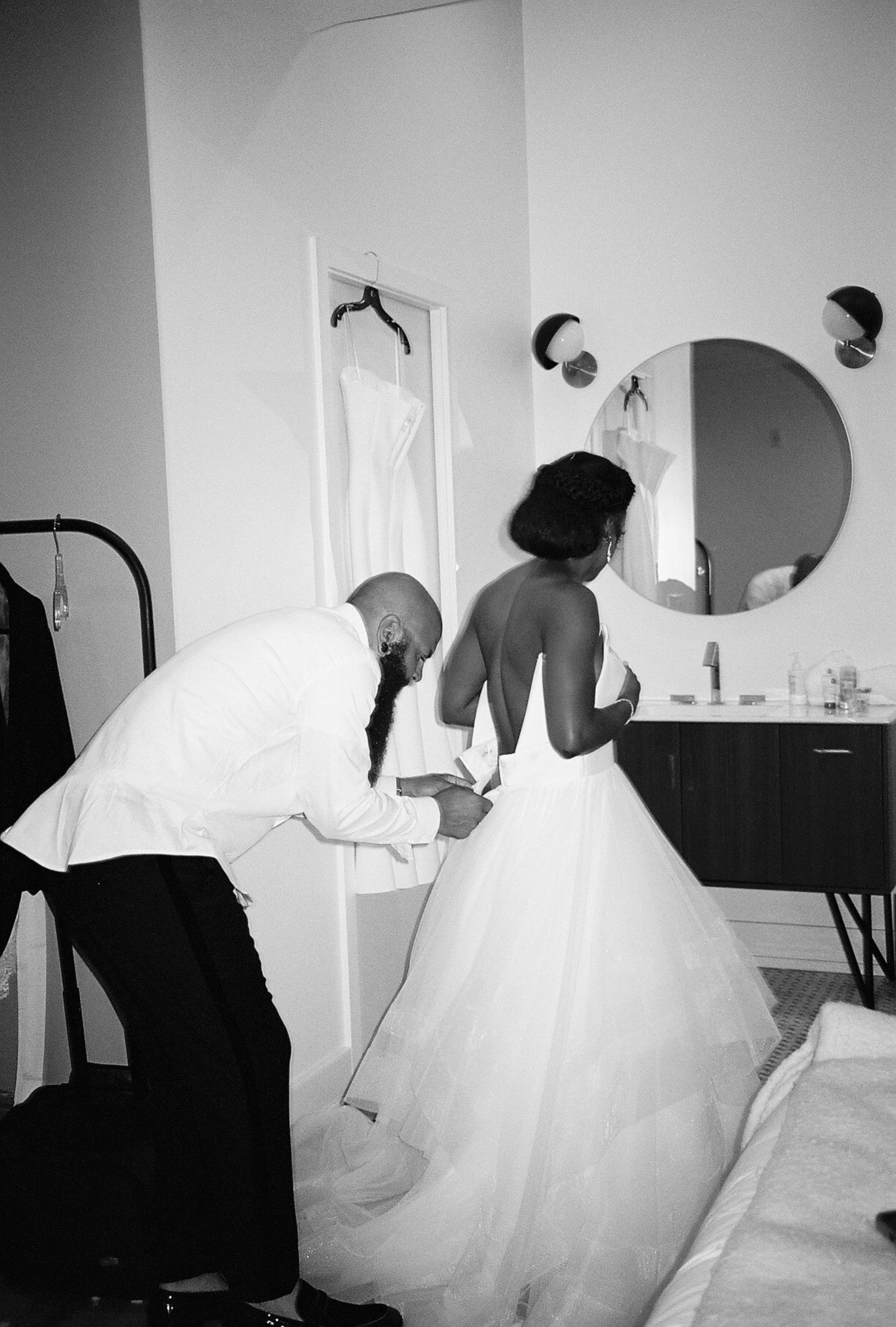 Behind the scenes preparation moments in black and white as bride gets ready.