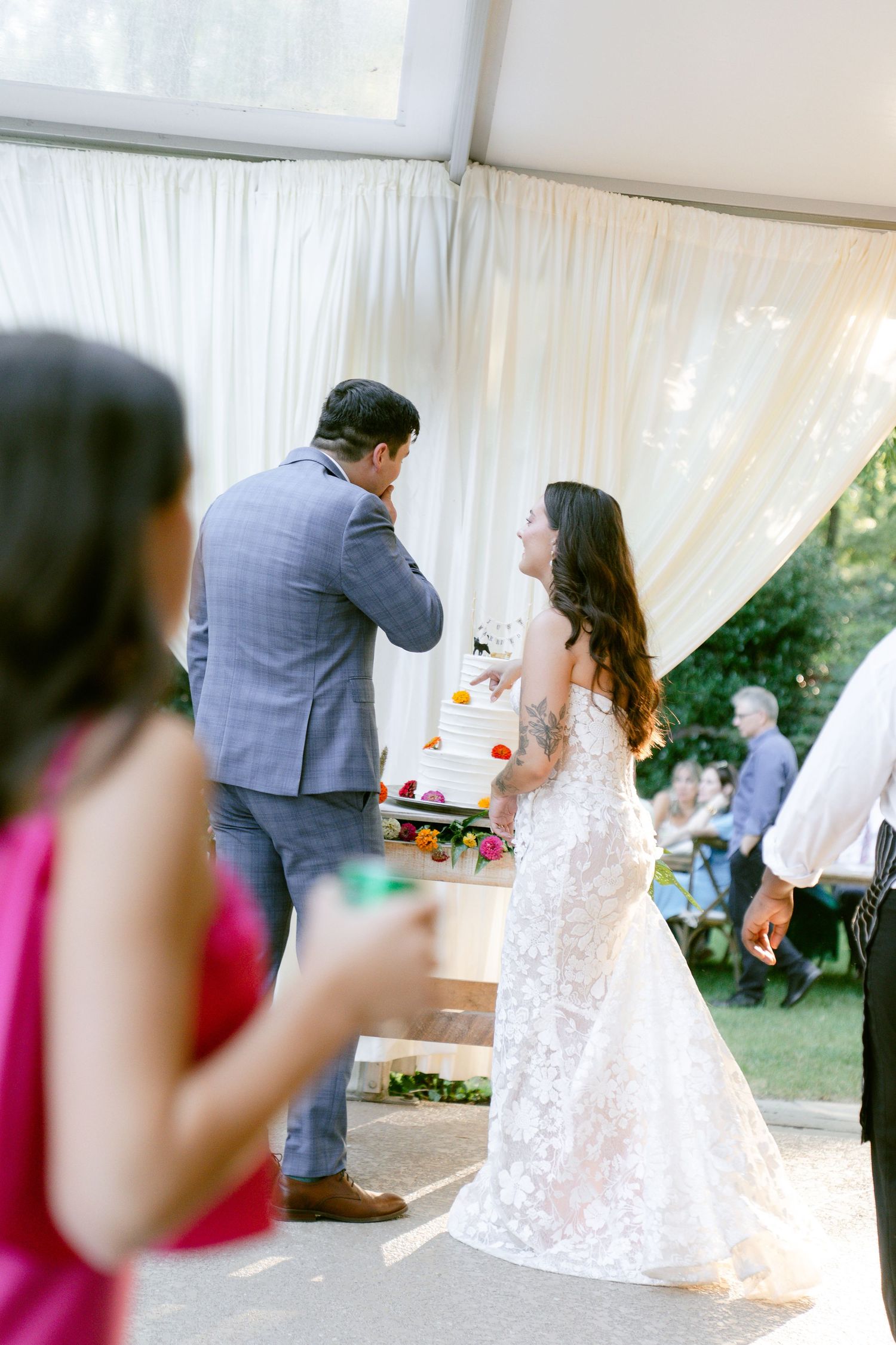 Wedding reception sequence showing couple's first dance under white tent decorations.