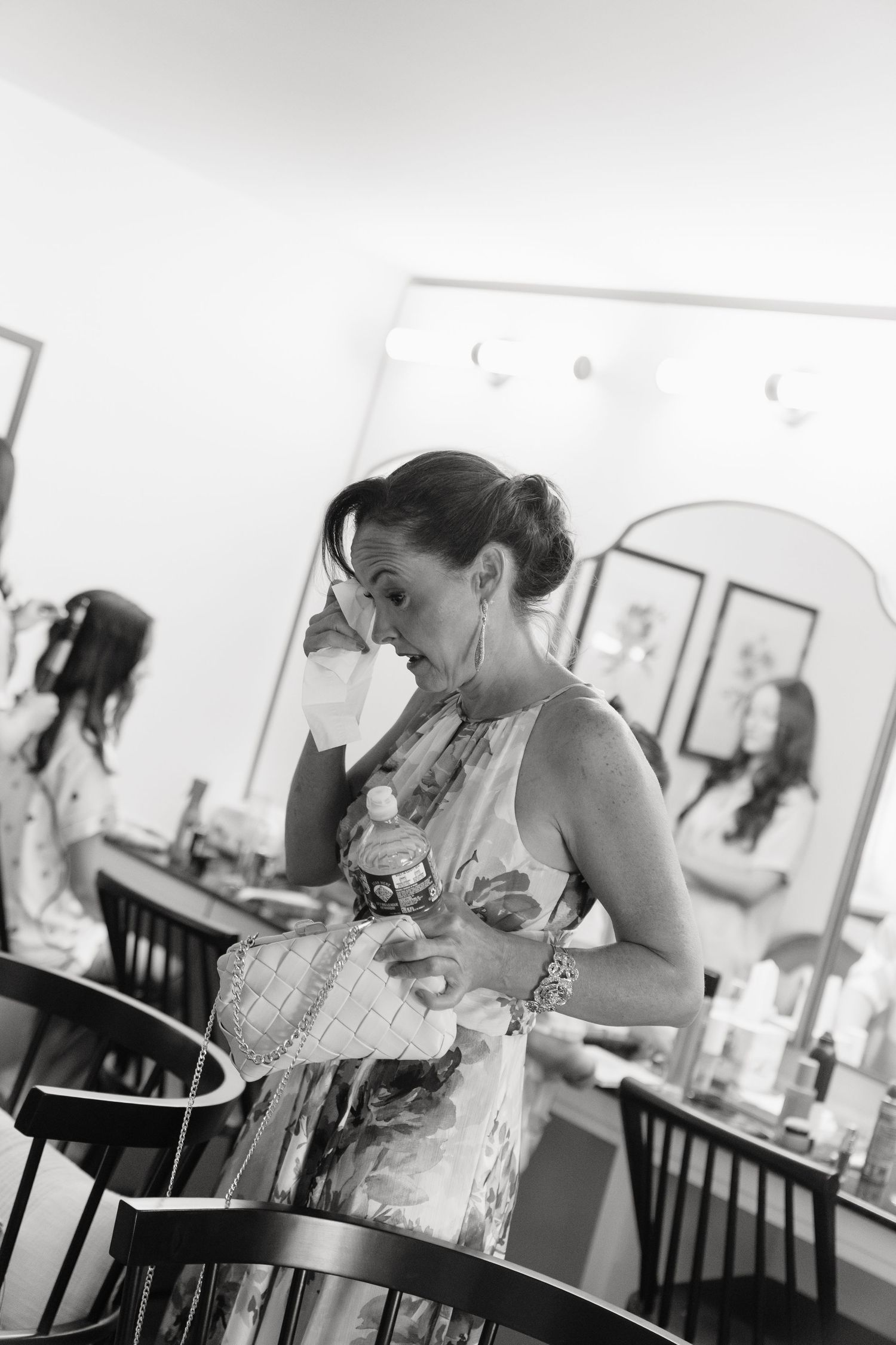 Black and white images capturing candid moments during bridal preparations.