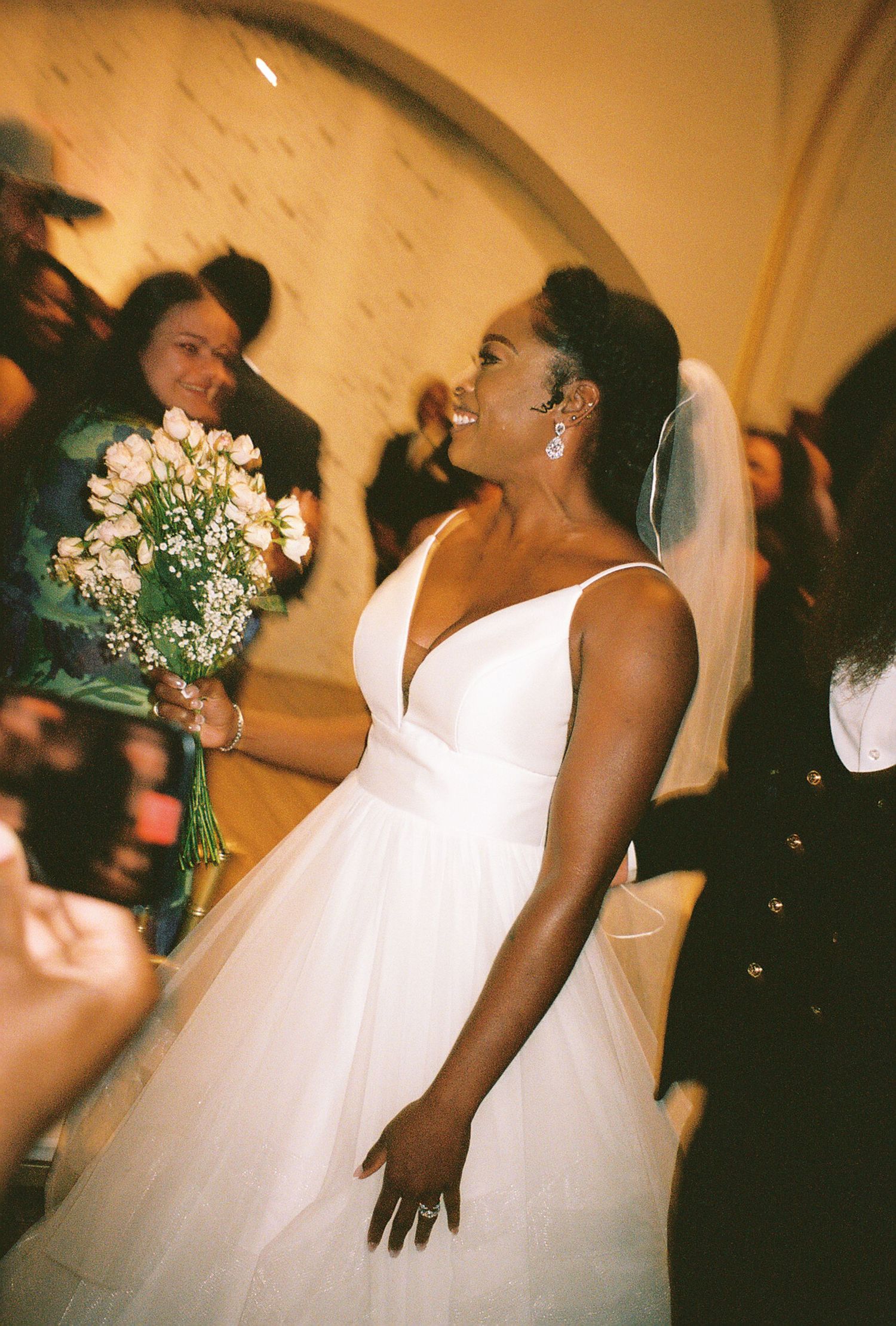 A sequence of joyful moments captured during a wedding celebration with a white dress and flowers.