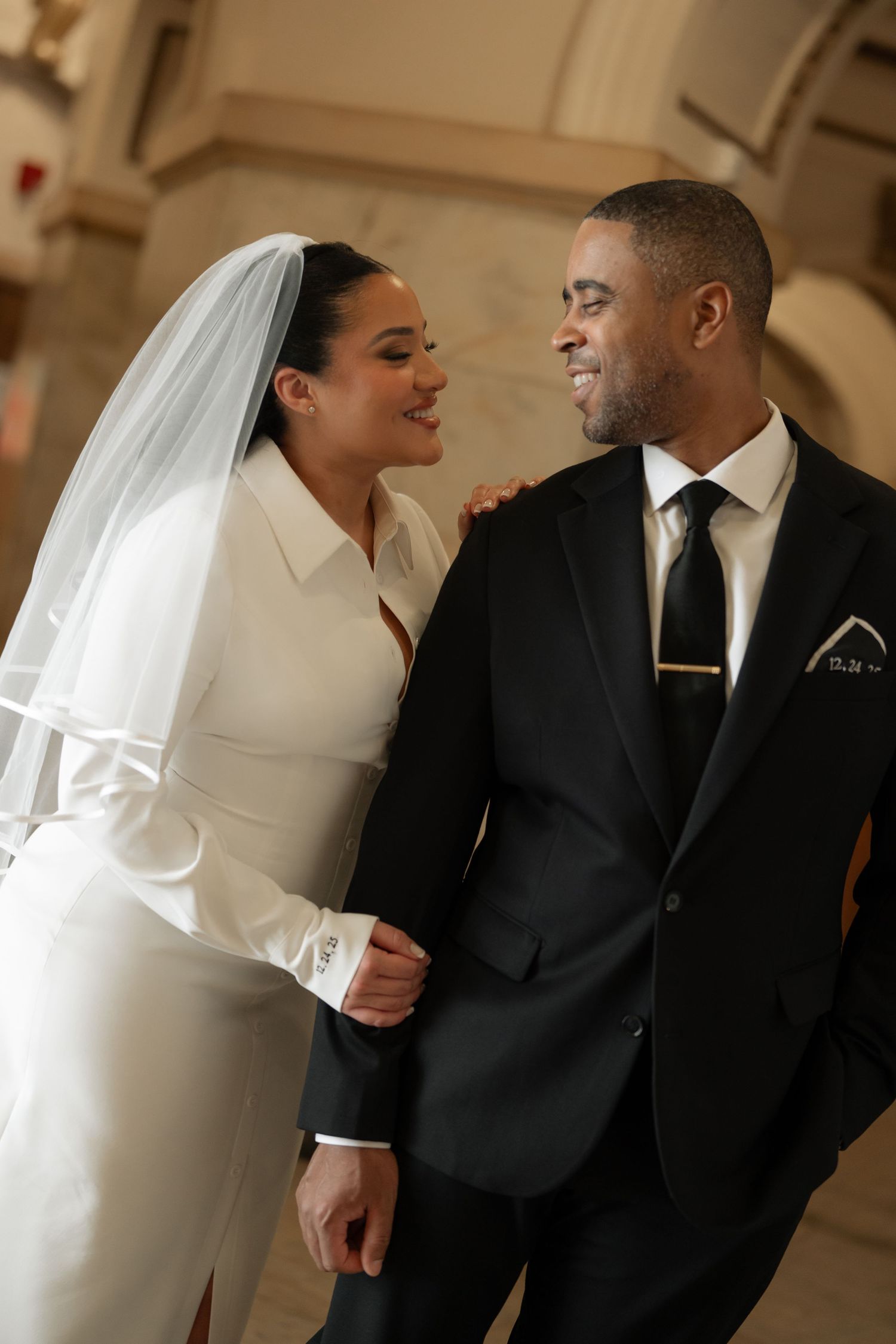 A happy bride and groom share a joyful moment together during their wedding ceremony.
