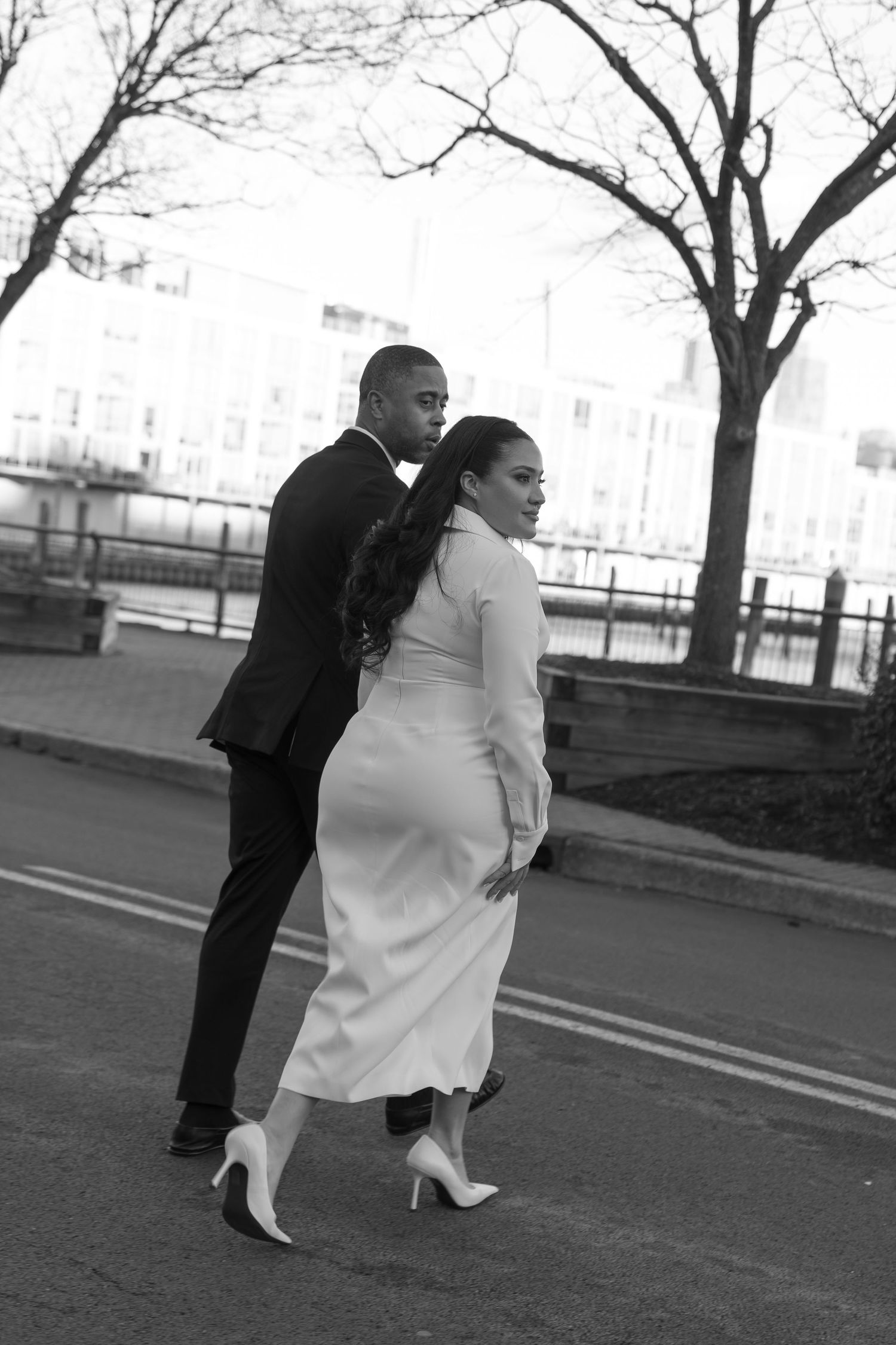 Black and white sequence of a couple walking outdoors among bare trees.
