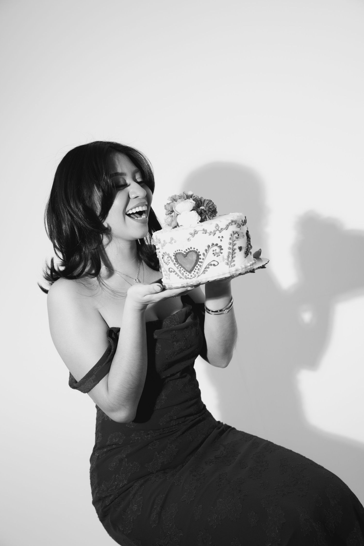 A sequence of black and white photos showing someone eating a slice of cake in progressive bites.