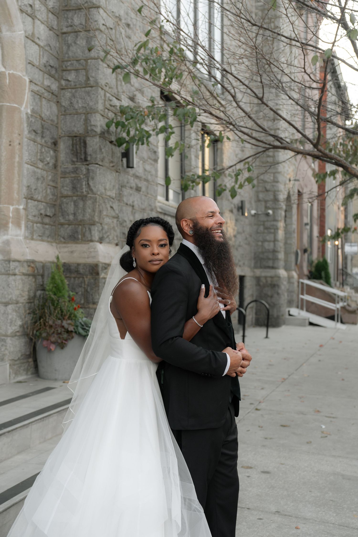 A series of candid wedding moments captured outside a historic stone church.