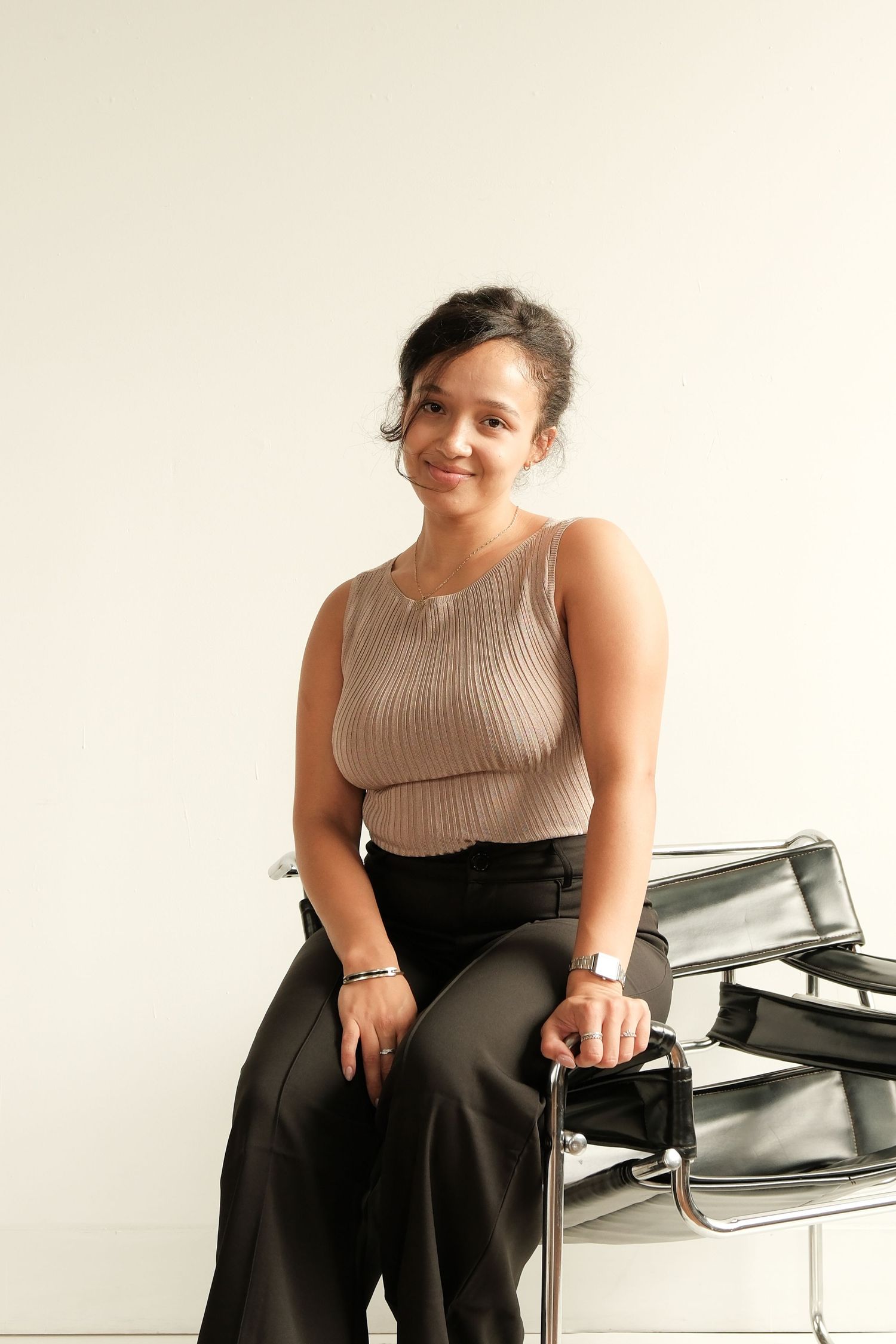 Professional studio portraits featuring elegant attire against a clean white background.