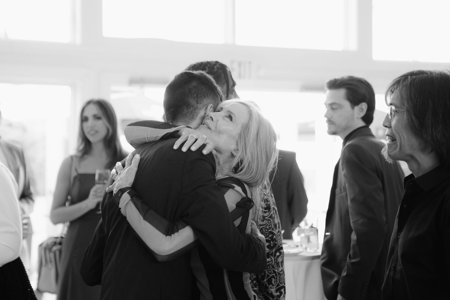 A series of black and white photographs showing couples dancing together in a ballroom setting.