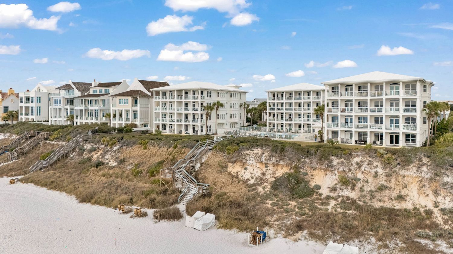 Drone photo of beachfront homes on the Emerald Coast, showcasing proximity to Gulf of Mexico by Coast Captured Real Estate Photography