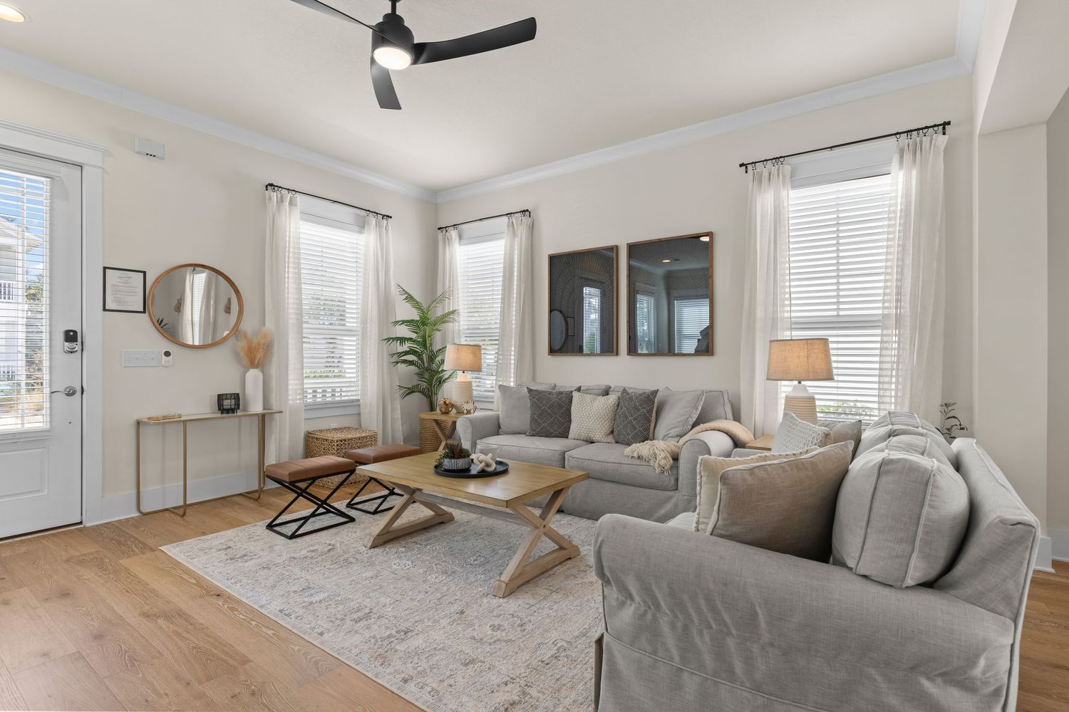 Bright neutral living room with soft coastal décor and natural light, photographed by Coast Captured for Emerald Coast listings