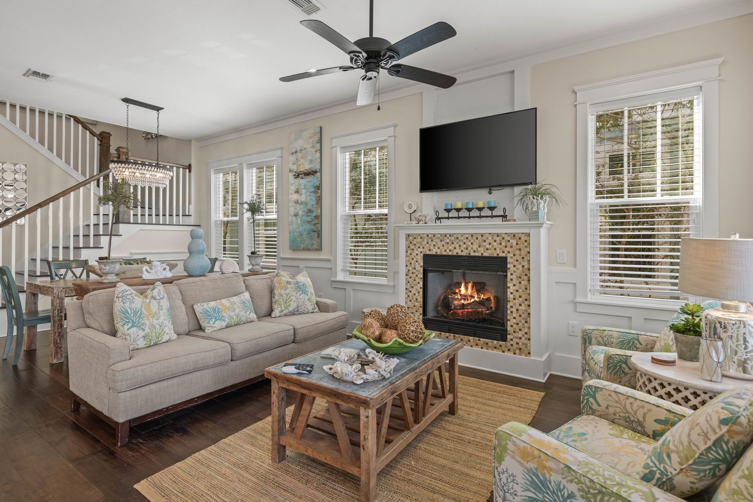 Inviting living room with fireplace and warm coastal design, interior photography by Coast Captured Emerald Coast Florida