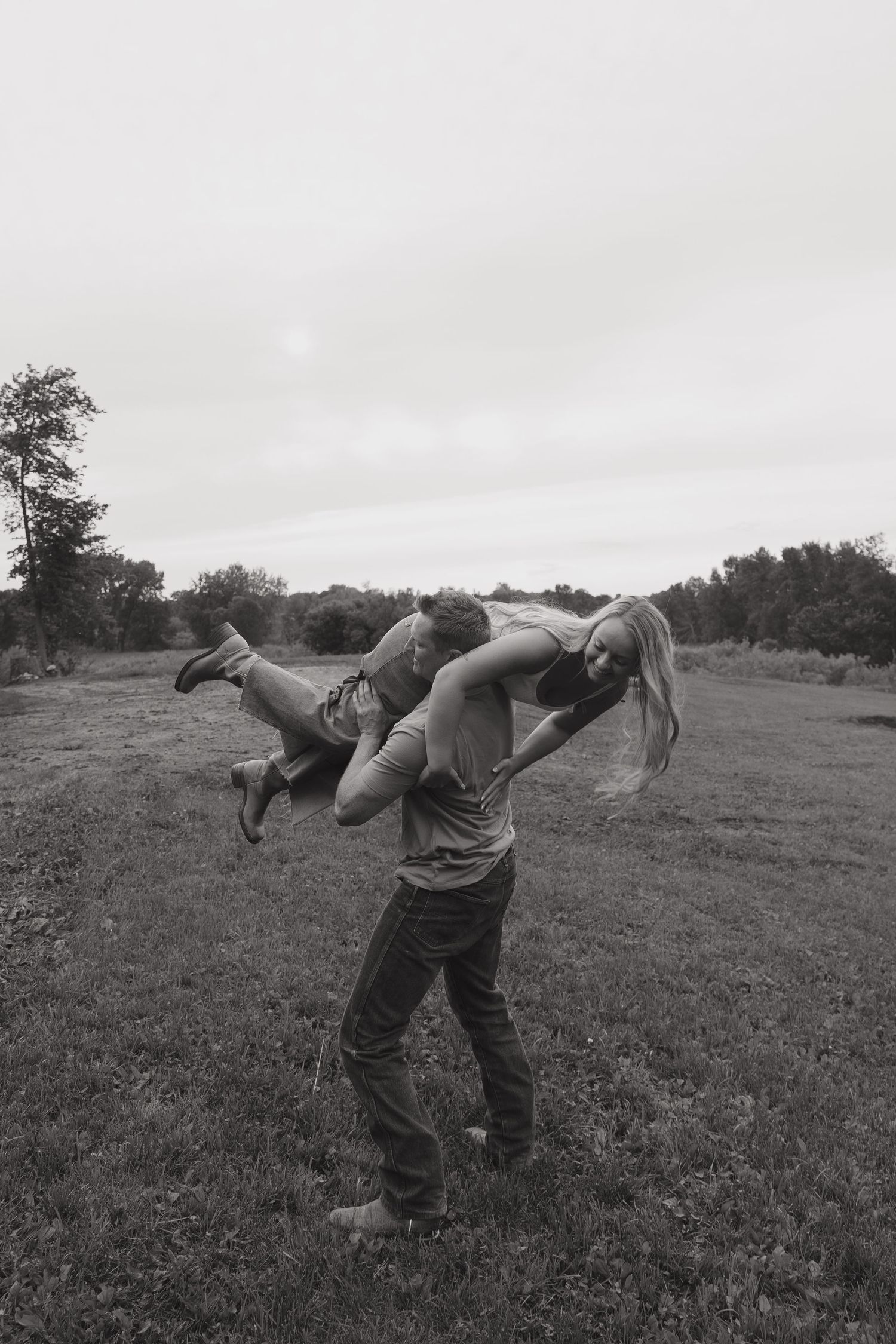 A black and white photo sequence shows someone being flipped over in a martial arts or self-defense demonstration outdoors.