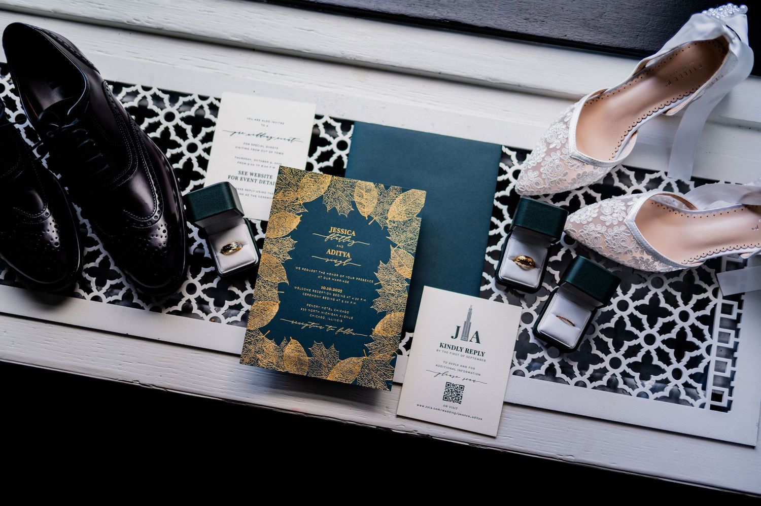 Wedding flat lay featuring dark green gold invitation, dress shoes, heels, rings, and accessories at The Pendry Hotel in Chicago Illinois.