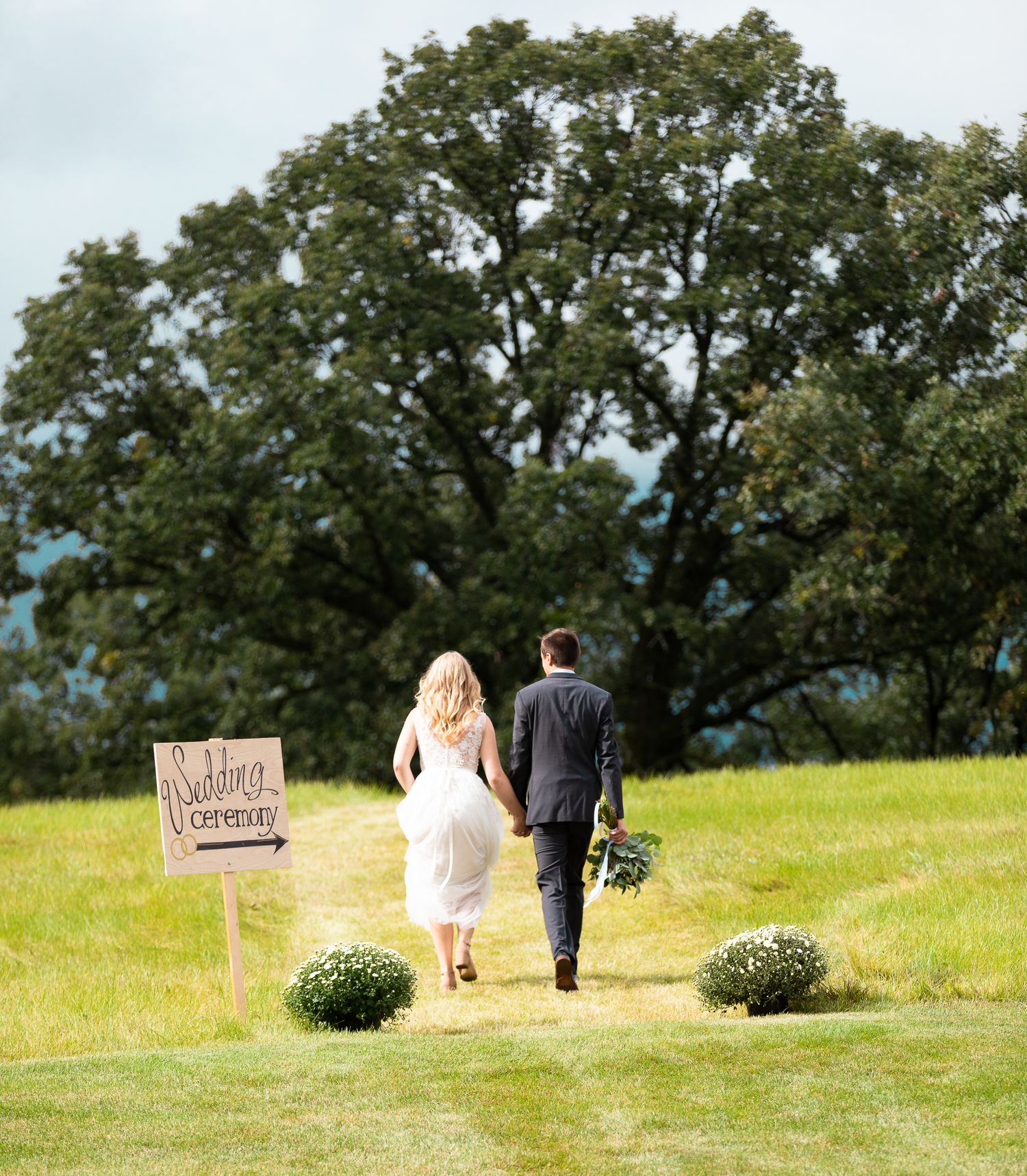 wedding couple walks to ceremony site