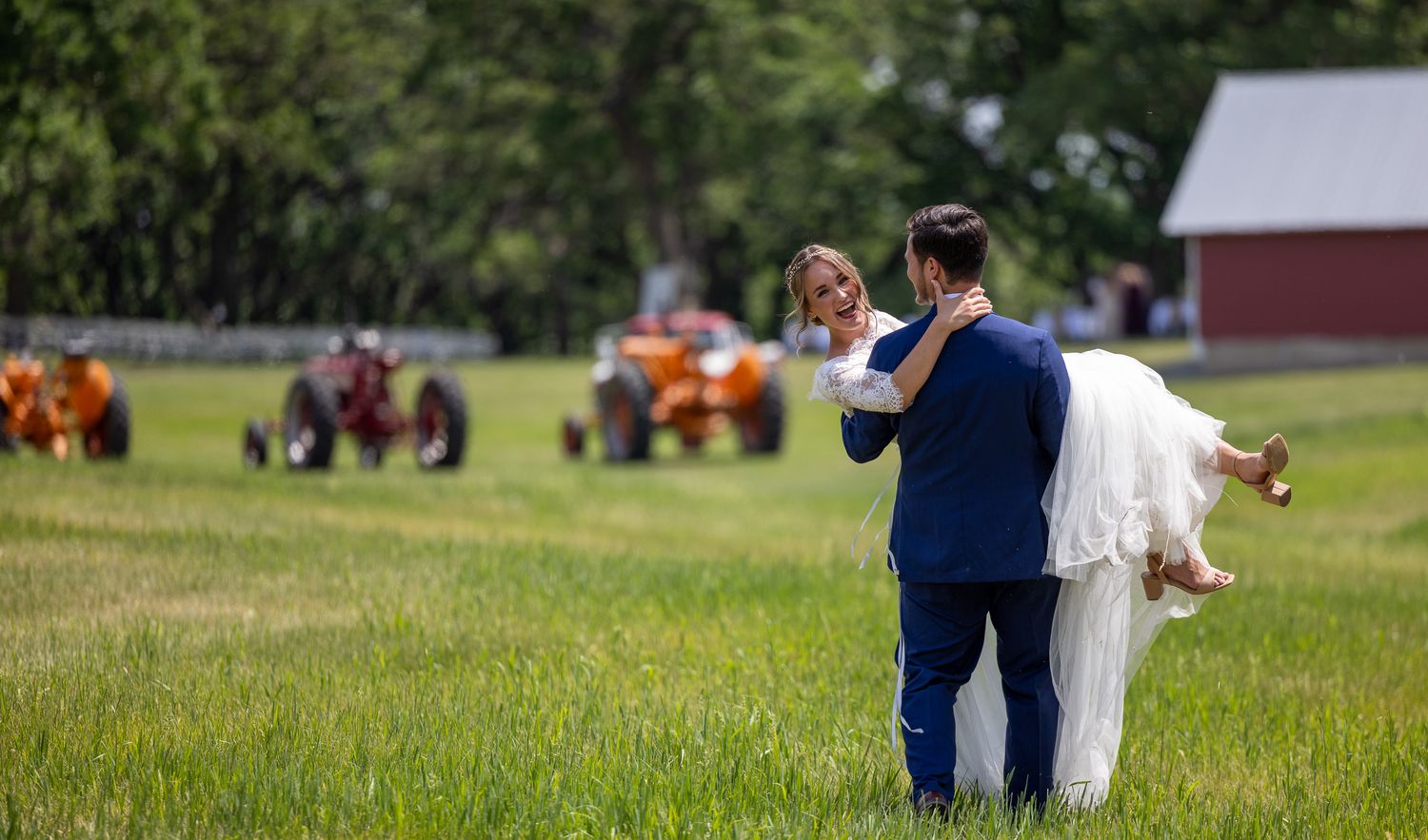farm wedding couple with tractors