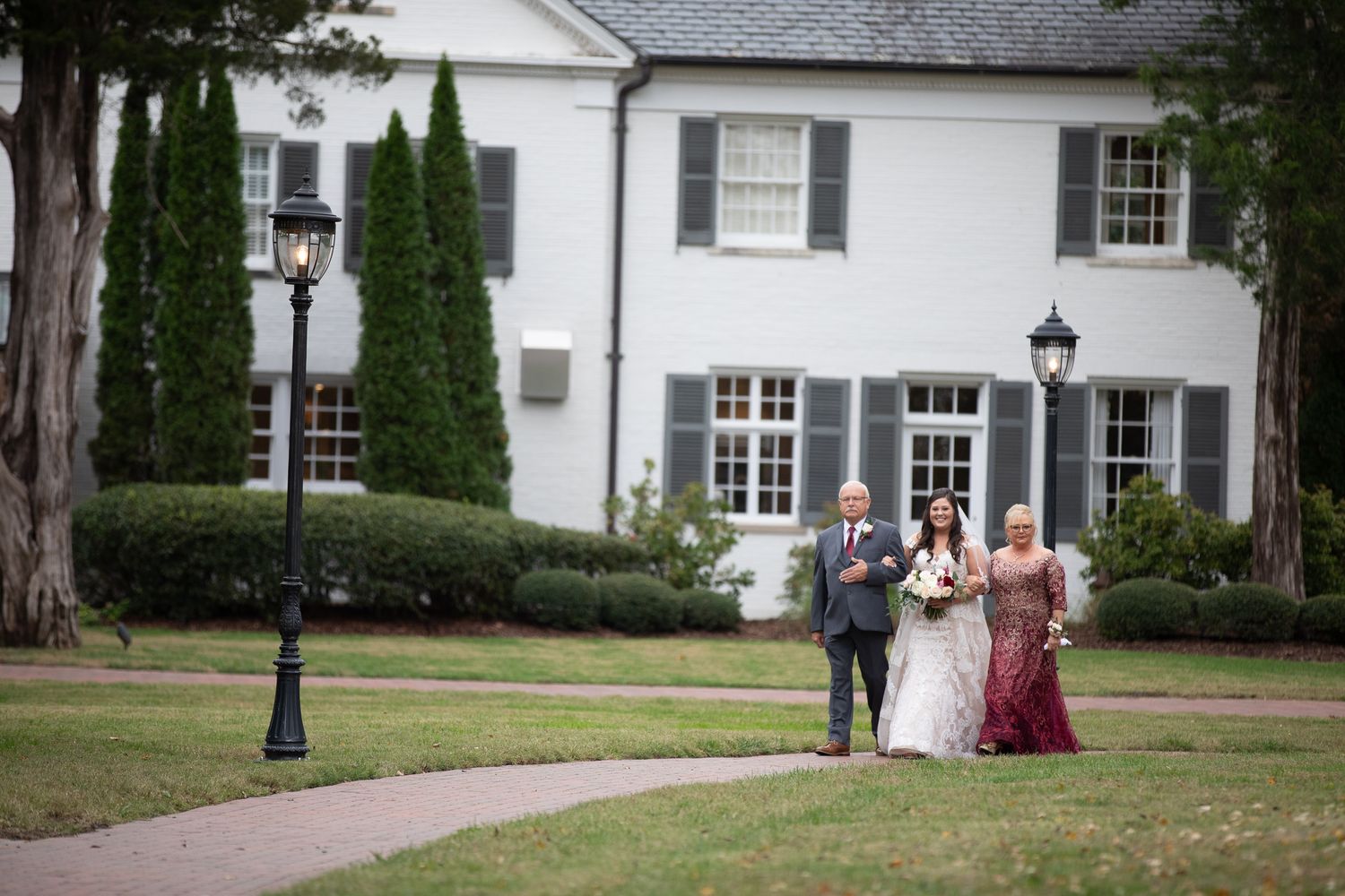 parents walk bride to ceremony