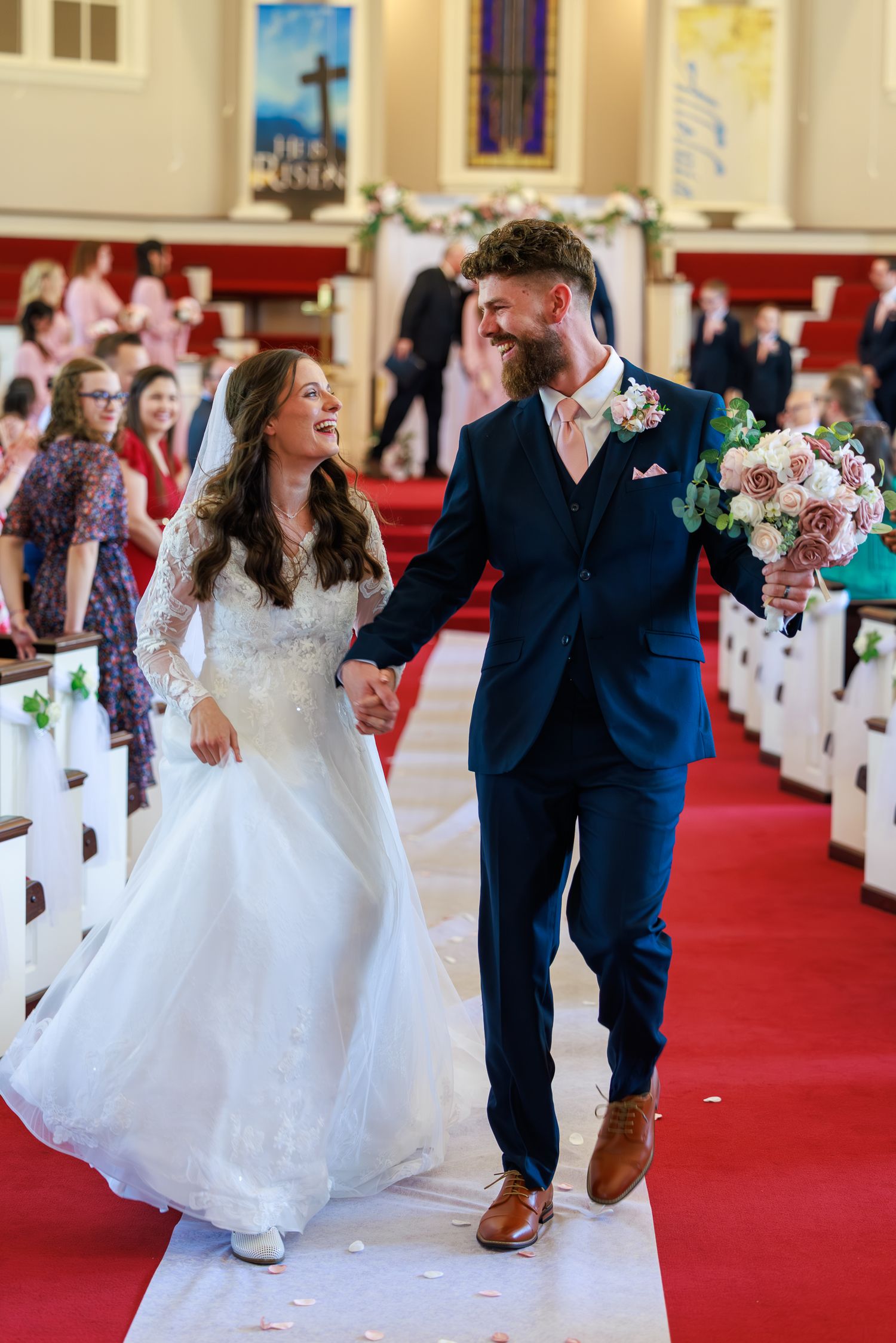 happy couple in aisle