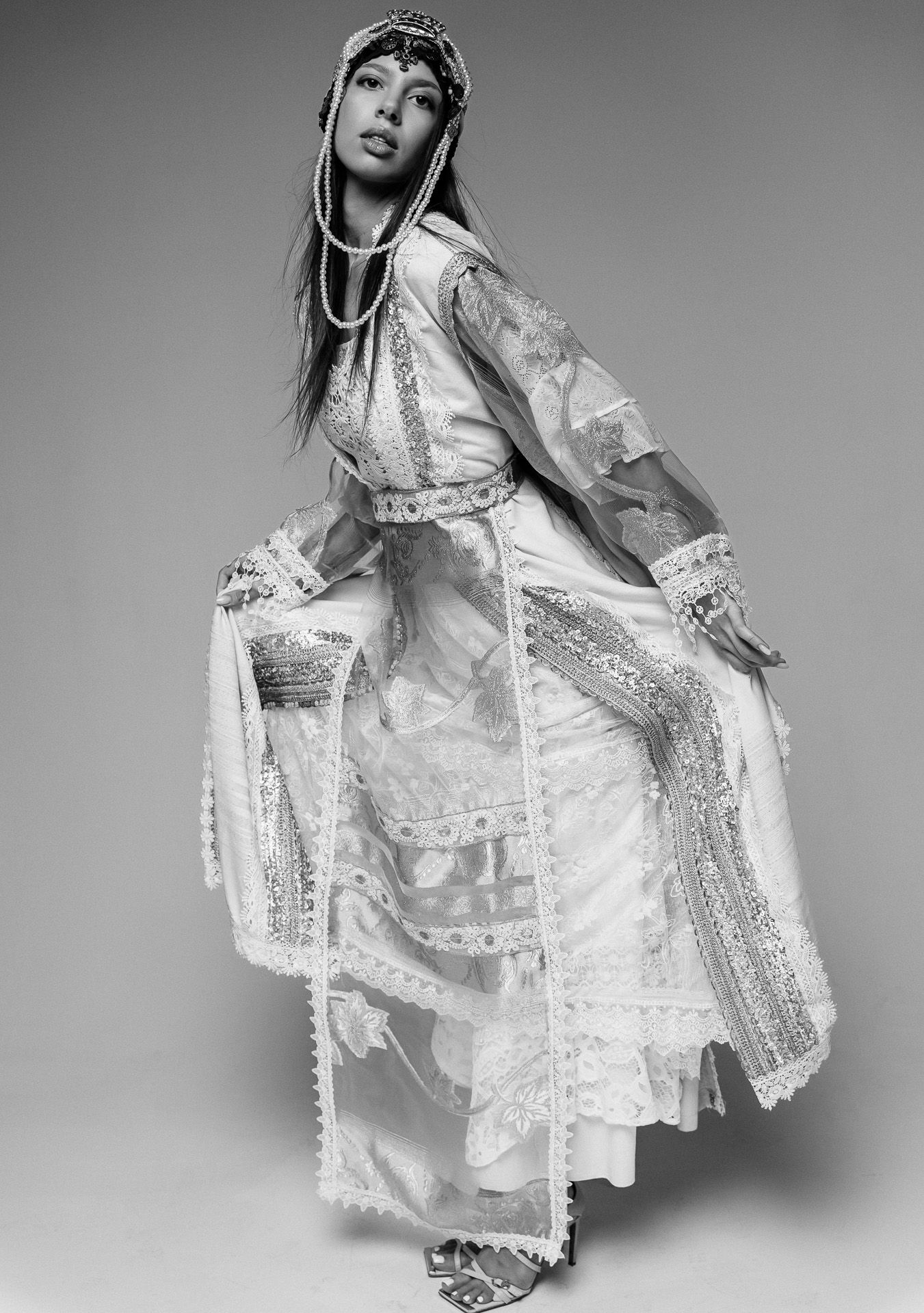 Fine art black and white portrait photography with elegant styling and soft shadows