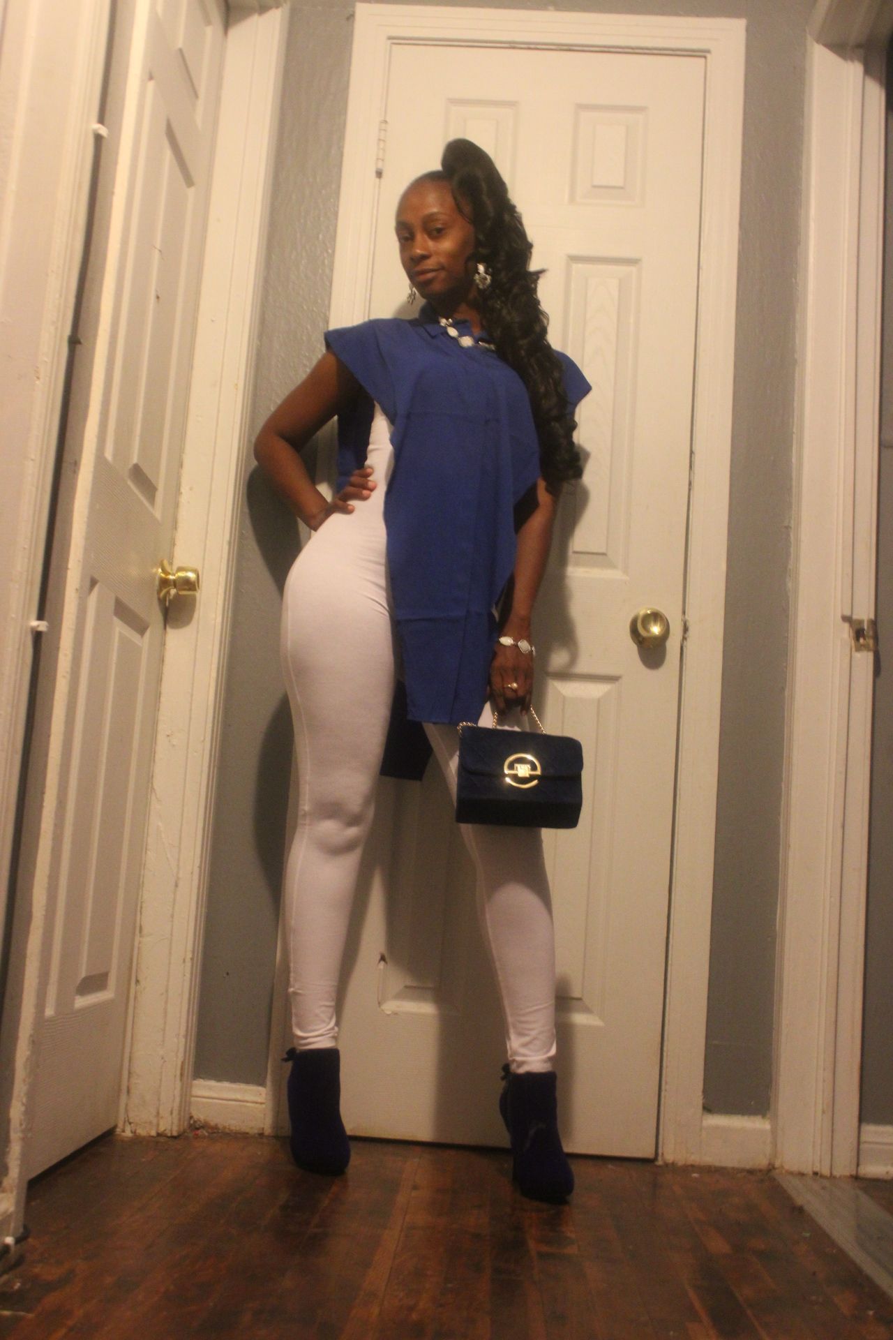 Portrait of a woman wearing a blue outfit posing indoors, photographed by ISHANIKA_PHOTOS_.