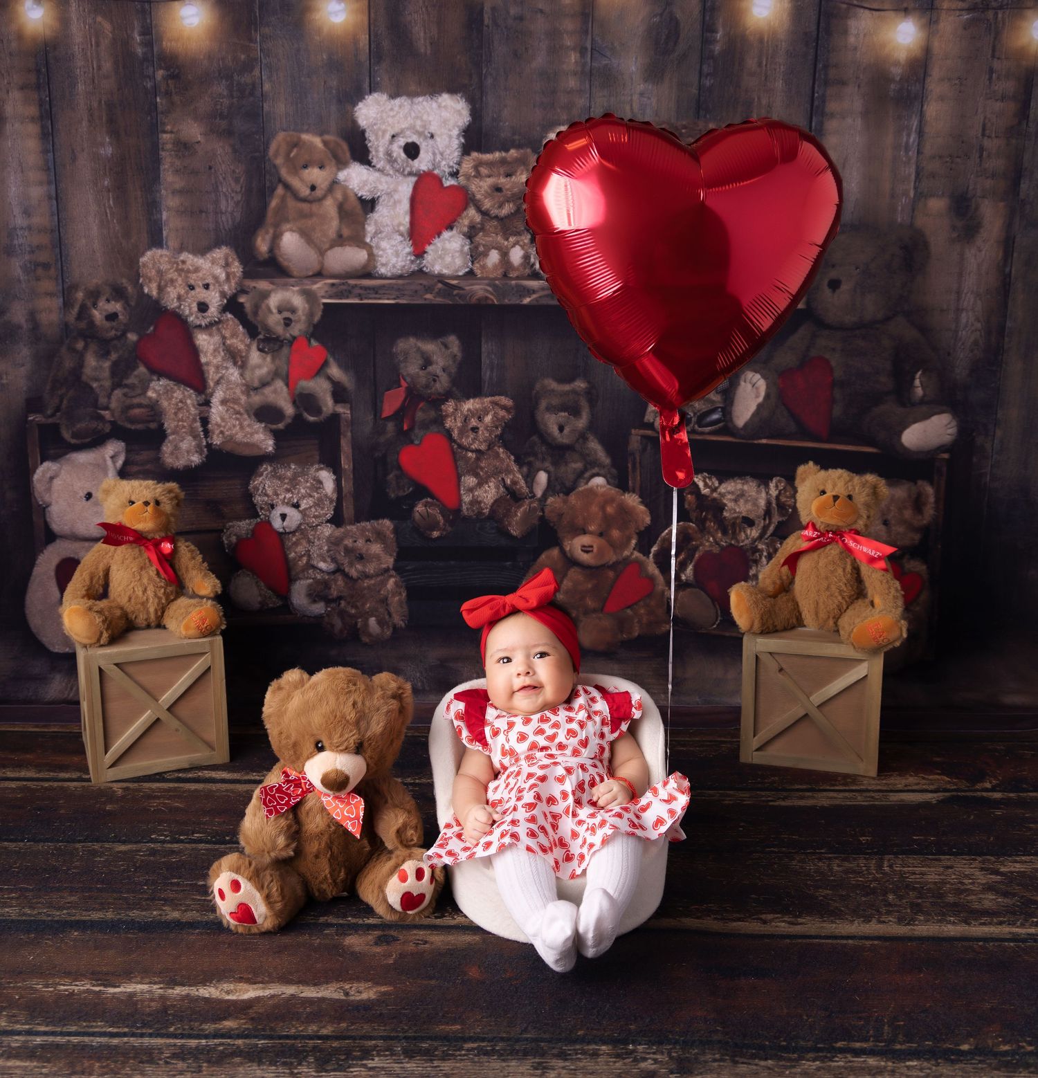 Teddy bears arranged with red heart balloons and Valentine's Day decor on rustic wooden backdrop.