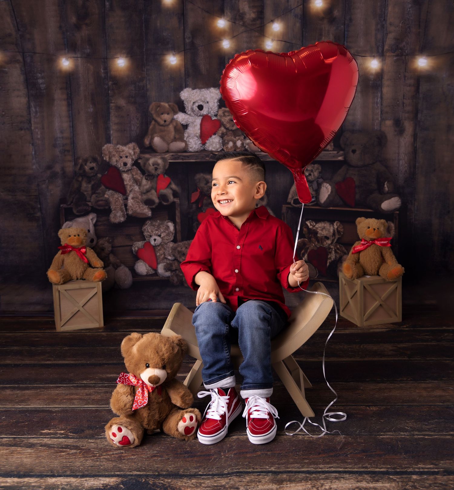 Valentine's day portrait with teddy bears and a red heart balloon in a rustic wooden setting.