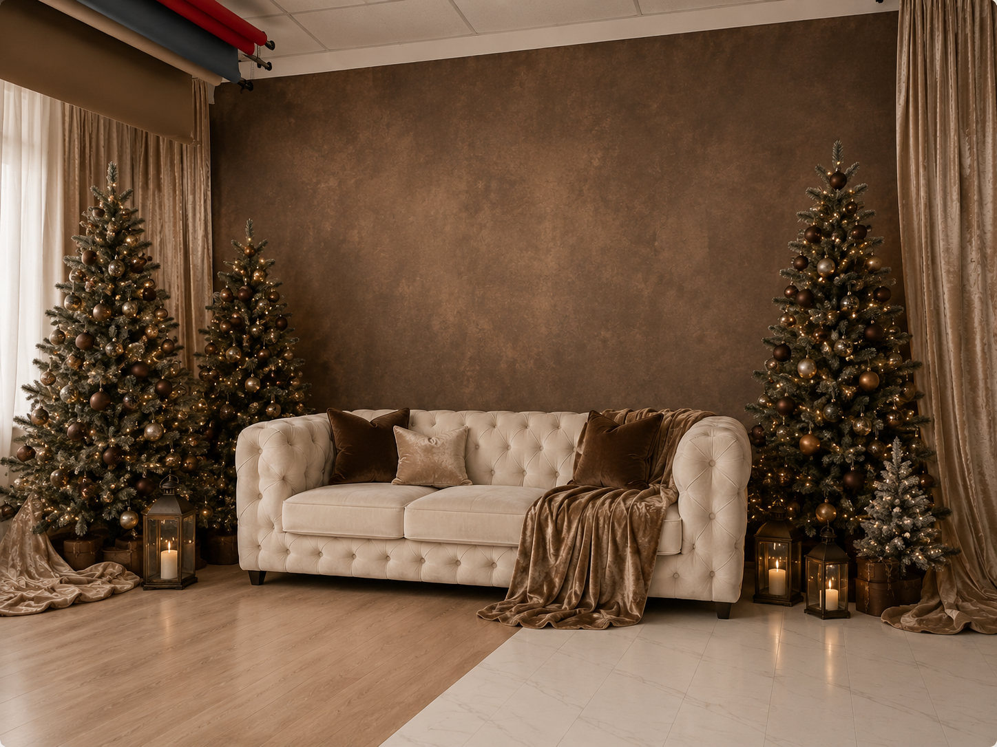 Elegant living room with tufted cream sofa flanked by decorated Christmas trees and lanterns against brown wall.